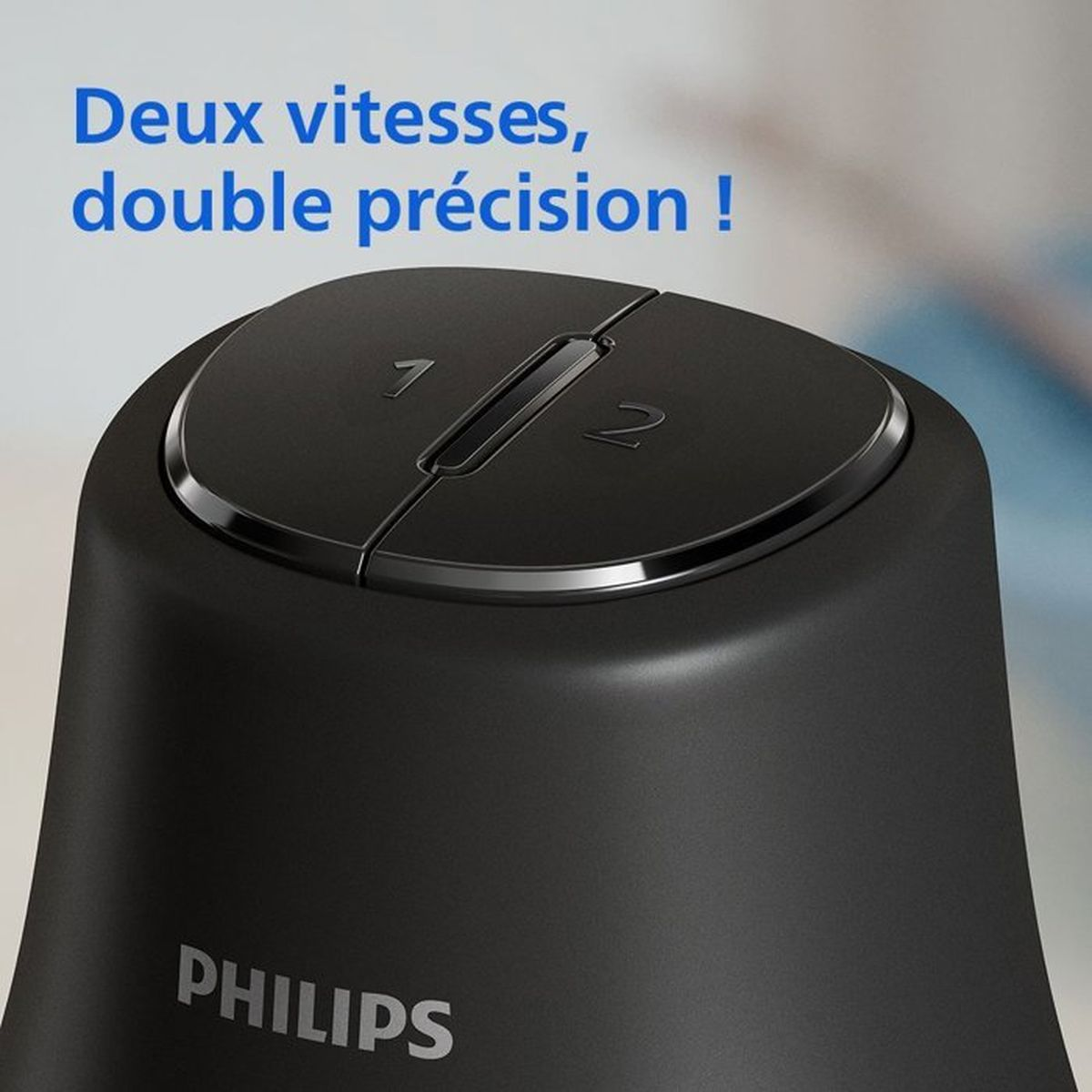 Dispositivo Philips nero con due impostazioni di velocità, 1 e 2, in alto.