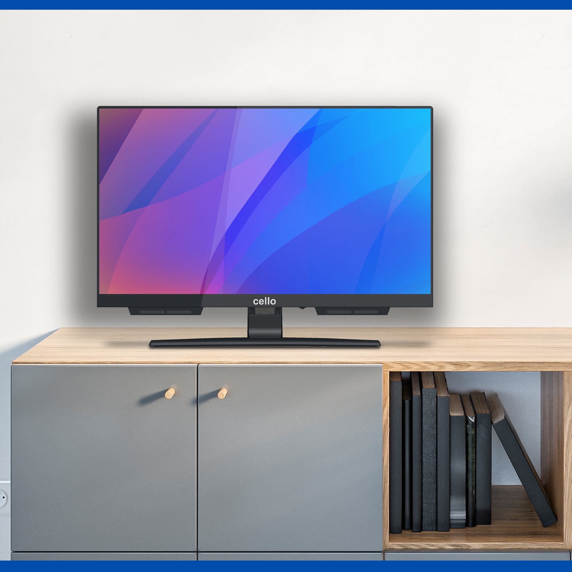 Un televisore nero con schermo colorato si trova su un mobiletto di legno.