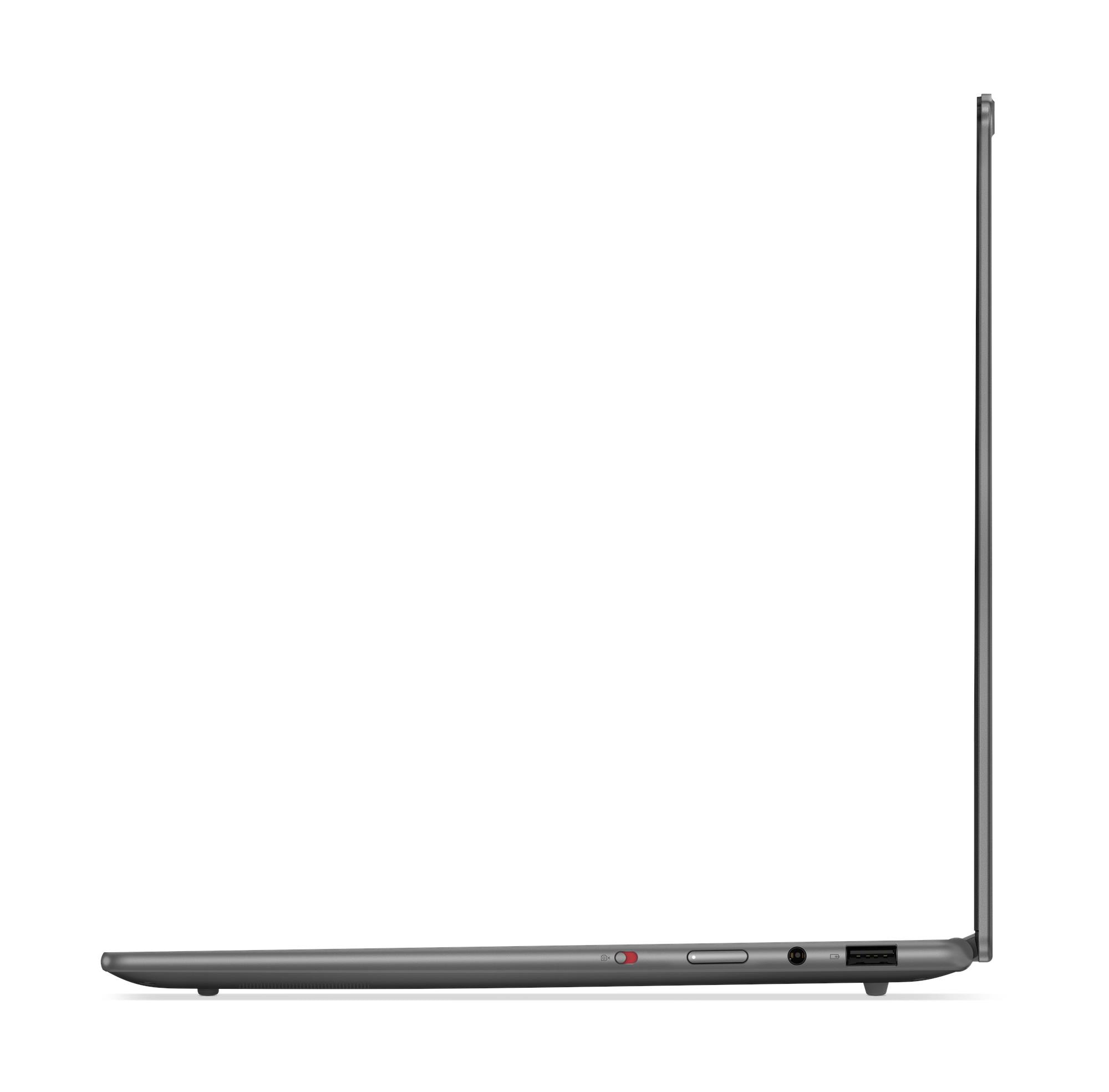 Un laptop grigio visto di lato, con porte USB e un pulsante di accensione.