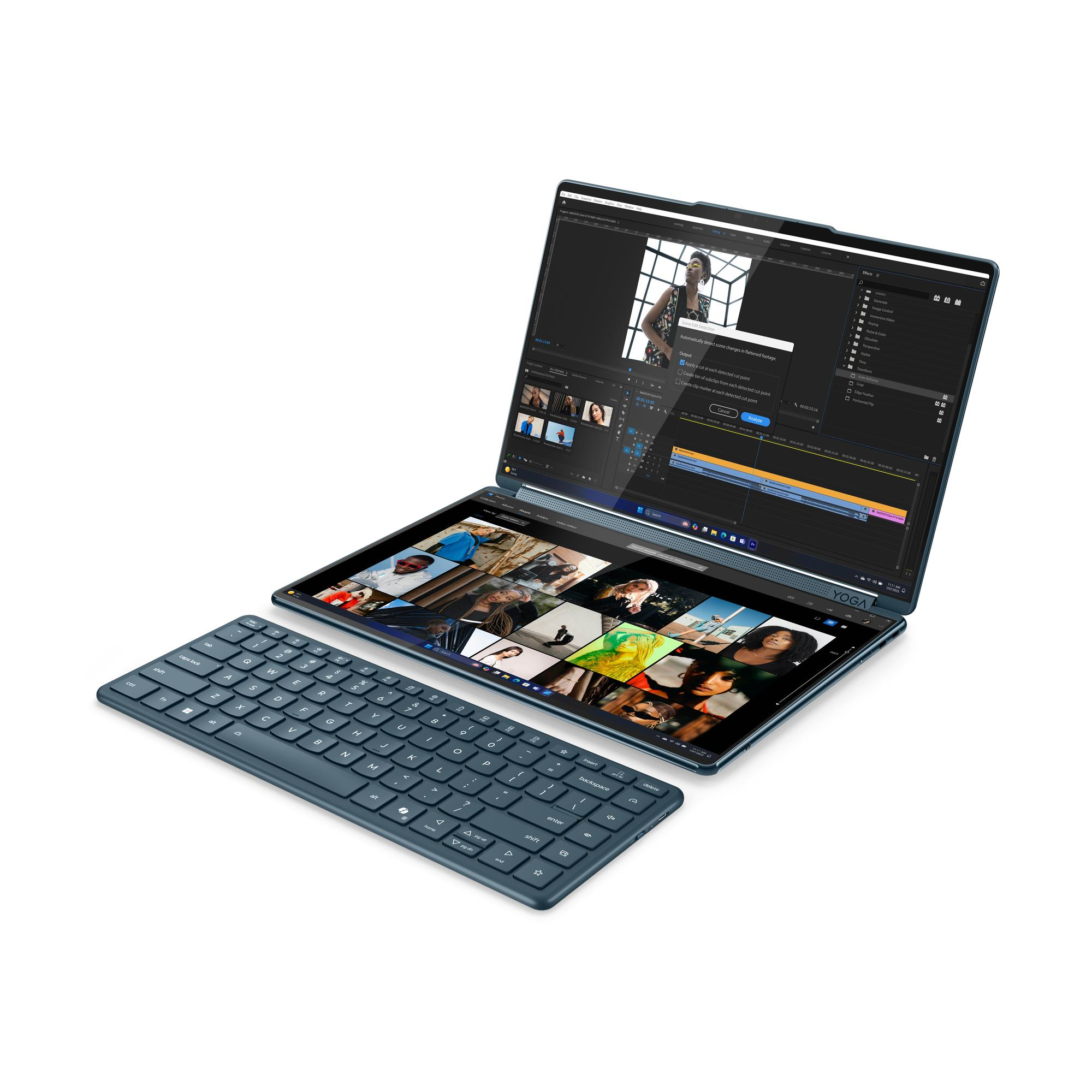 Un laptop aperto a doppio schermo con tastiera. Uno schermo mostra software di editing video.