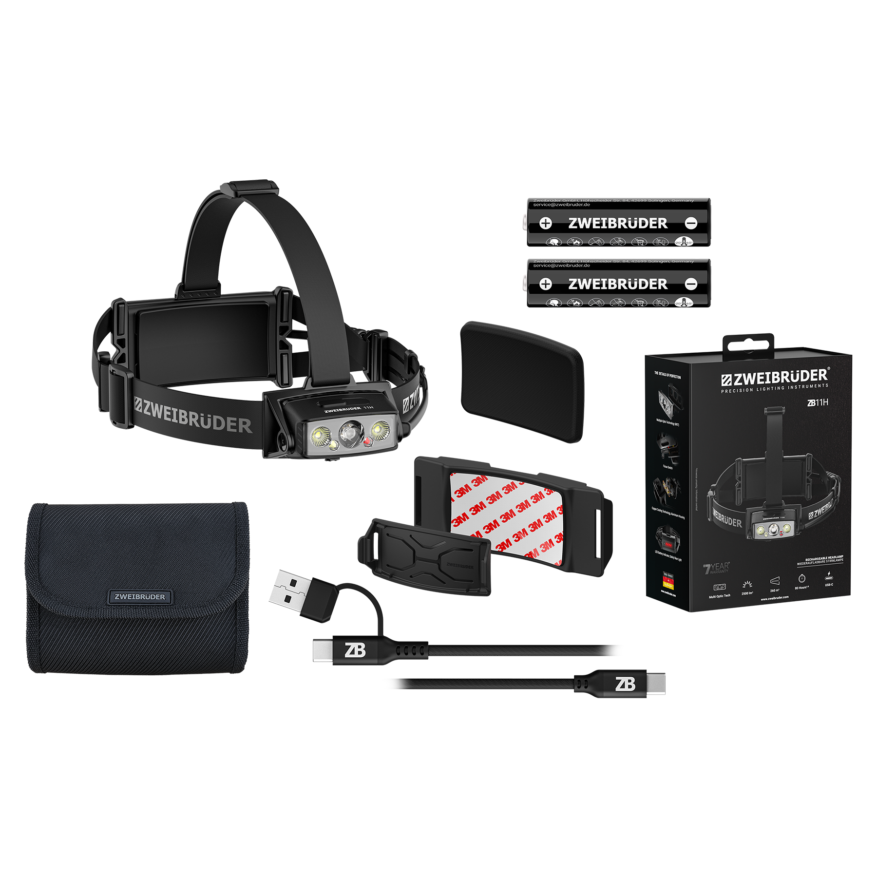 Ein schwarzer Scheinwerfer mit Zubehör, Batterien und Verpackung.
