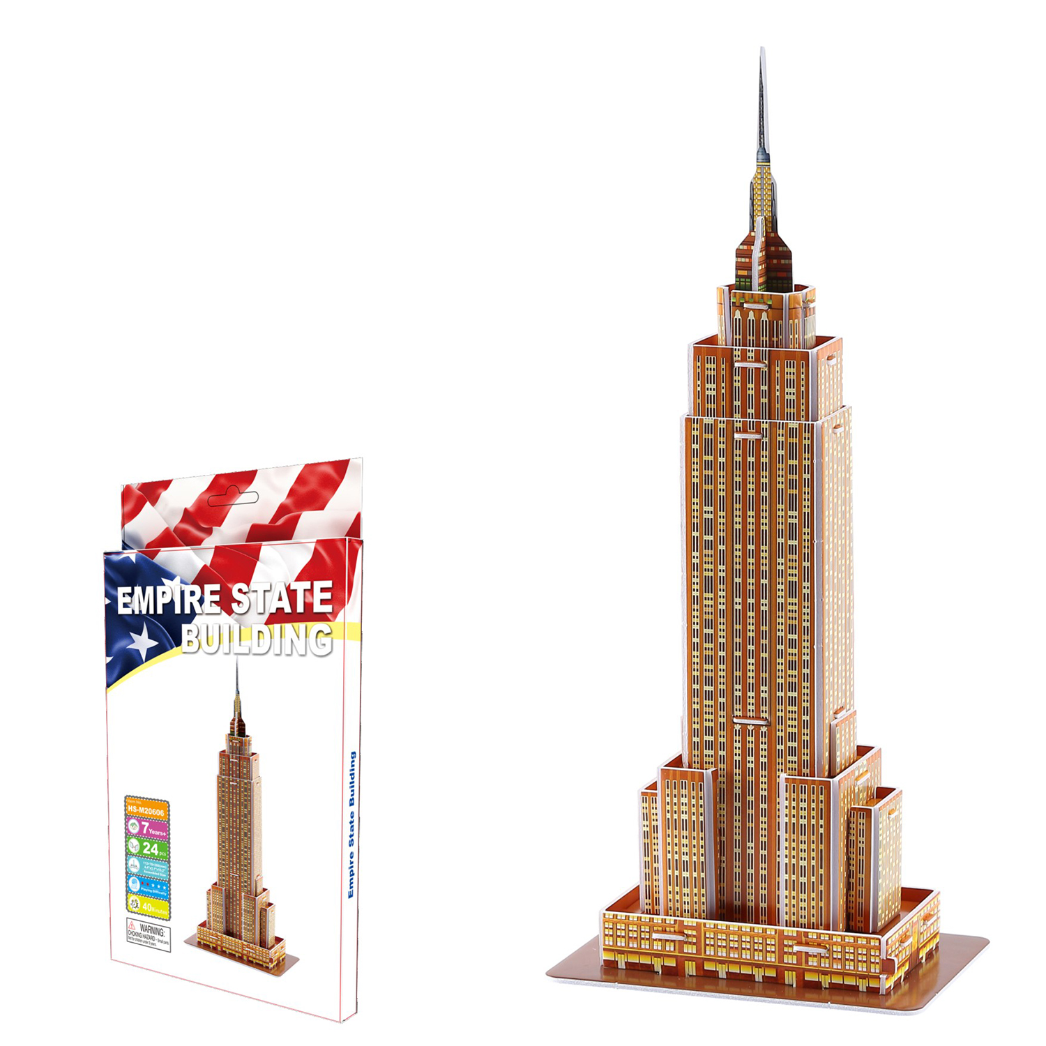 Puzzle 3D dell'Empire State Building accanto alla sua confezione con design a bandiera americana.