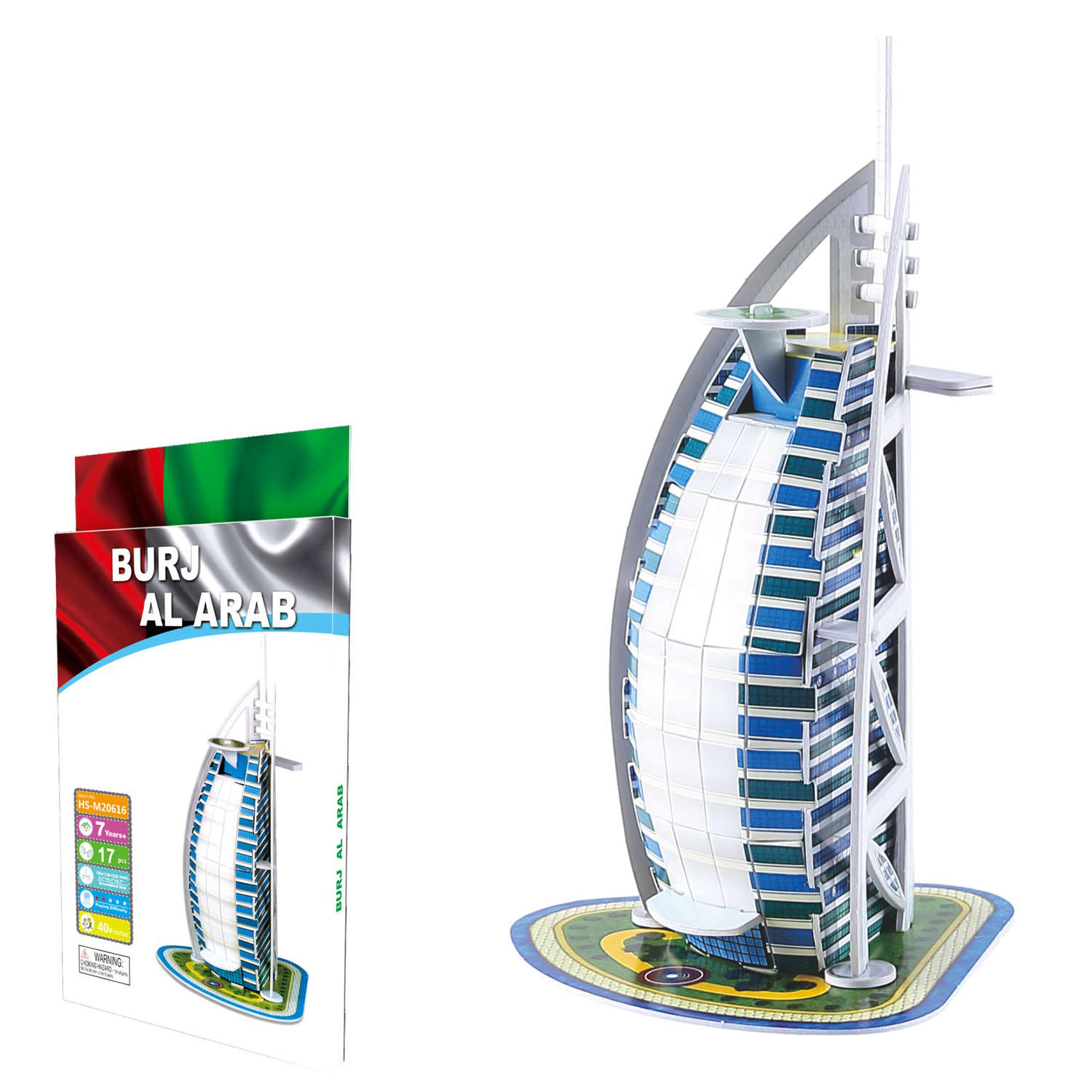 Un modello puzzle 3D dell'hotel Burj Al Arab accanto alla sua confezione.