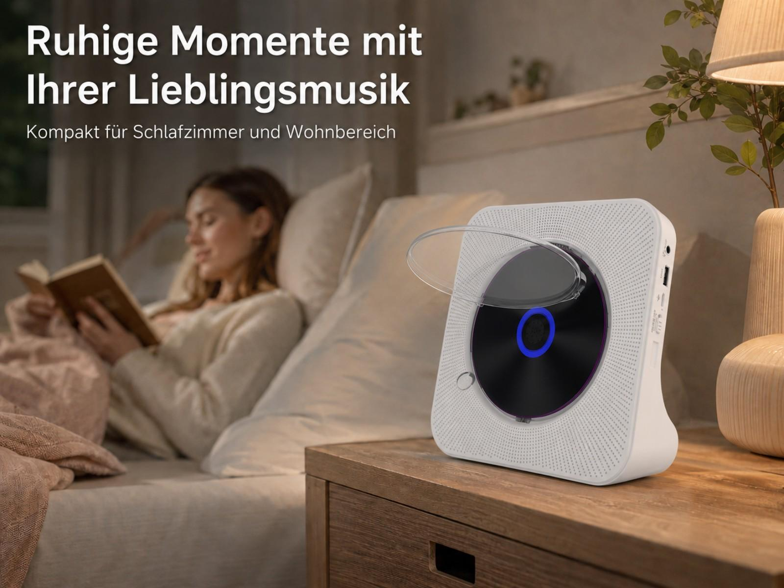 Eine Frau liest ein Buch im Bett, ein CD-Player steht auf einem Nachttisch.