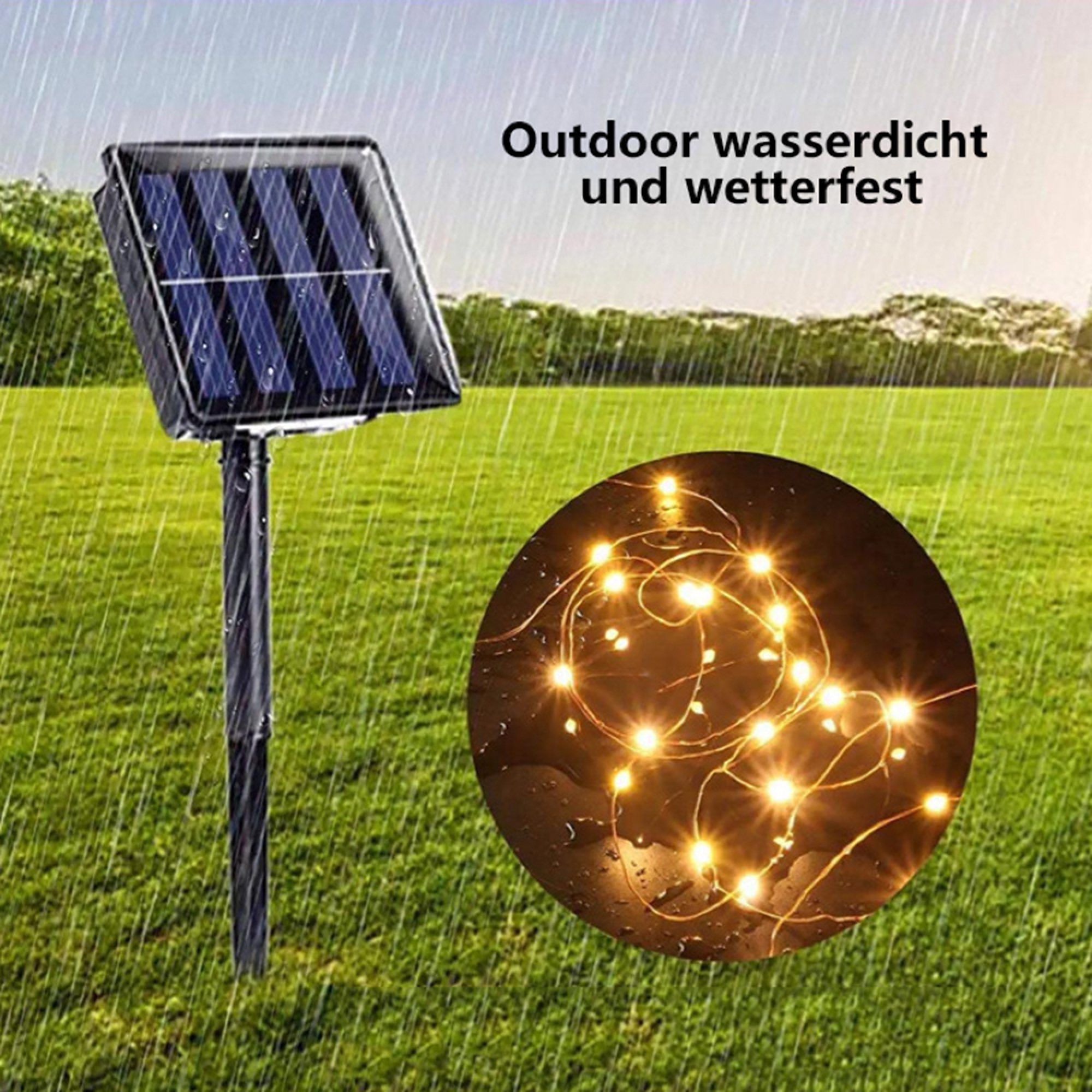 Solarpanel mit Lichterkette im Regen auf einer Wiese.