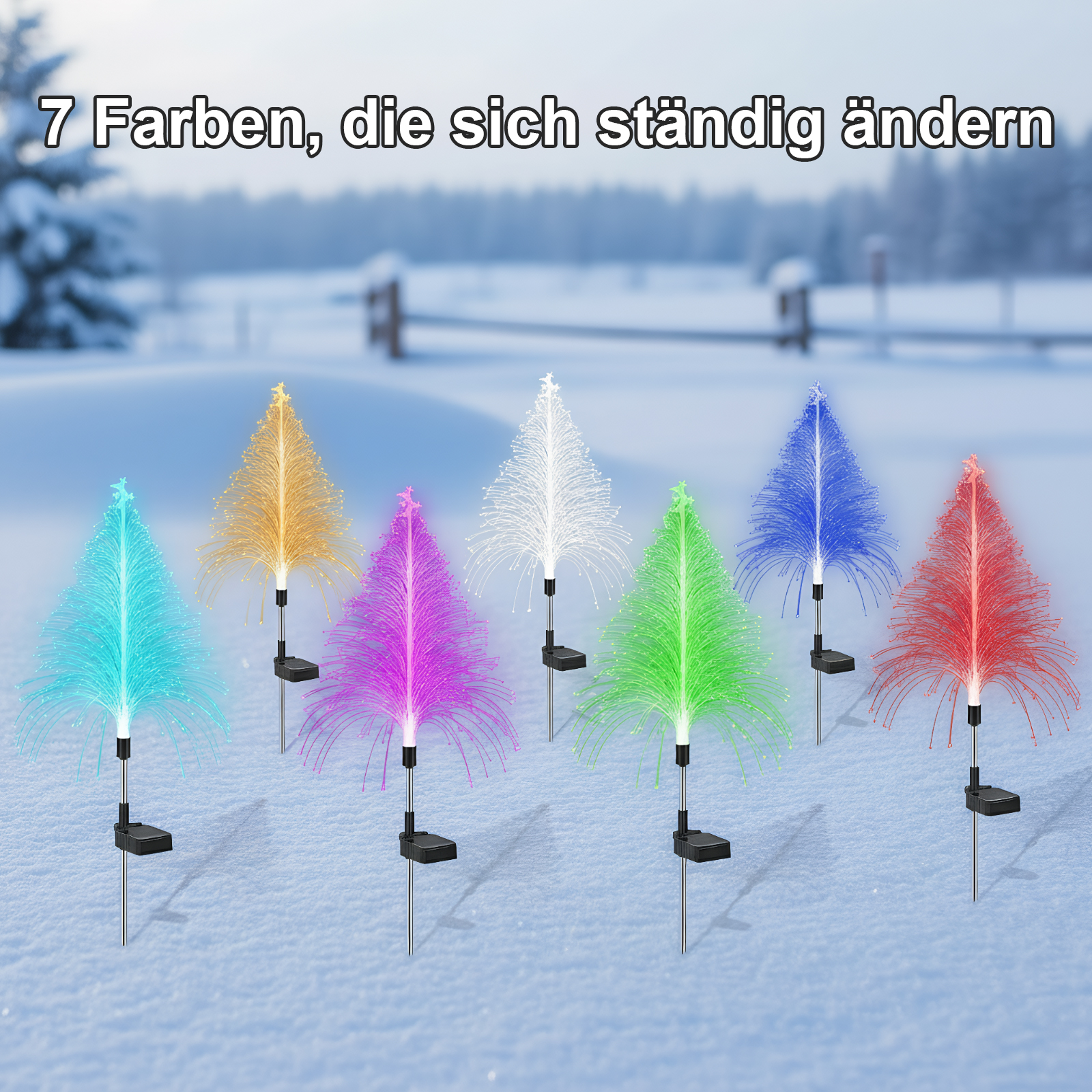 Bunte LED-Baumdekorationen im Schnee mit wechselnden Farben.