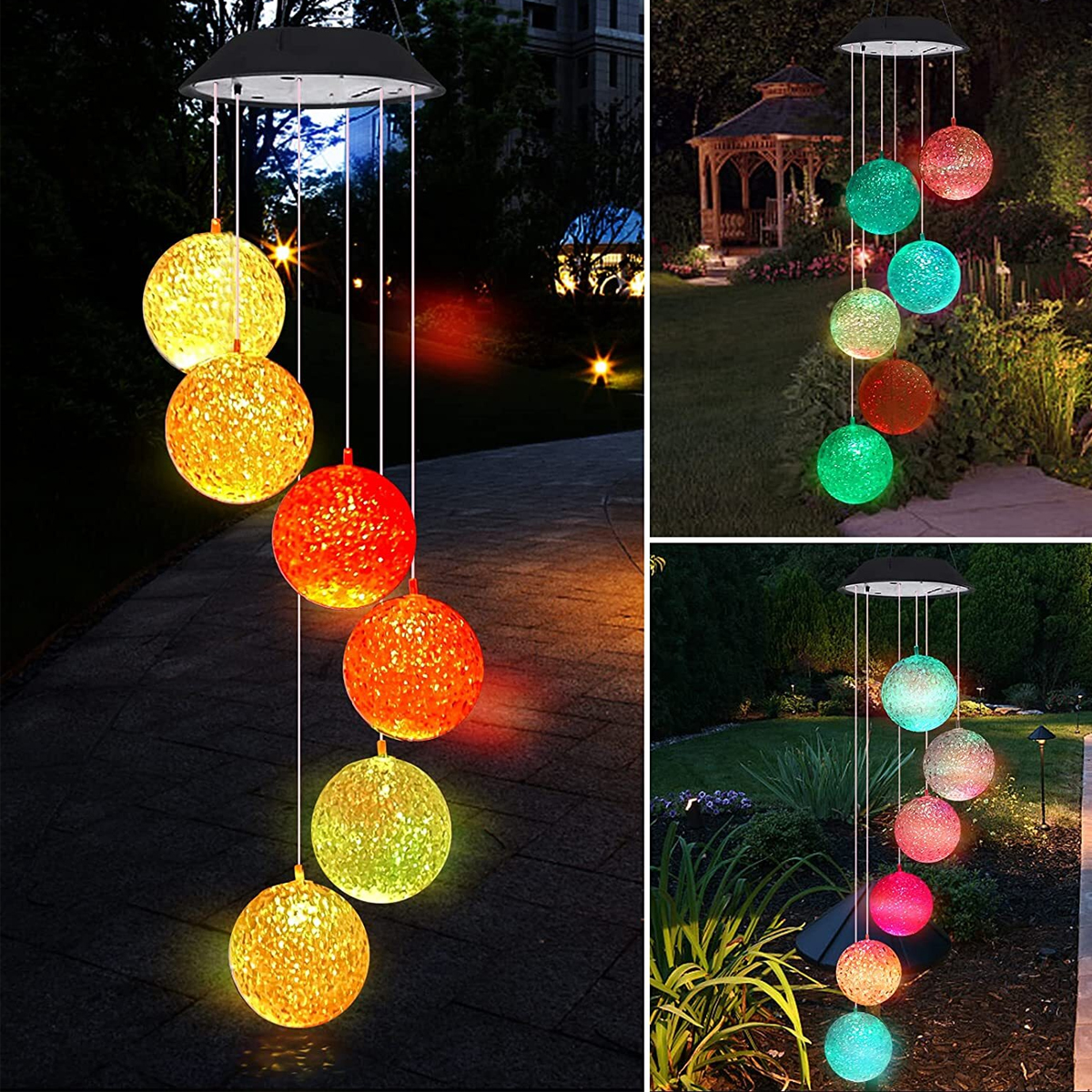 Solar-Windspiel mit bunten Kugeln im Garten bei Nacht.
