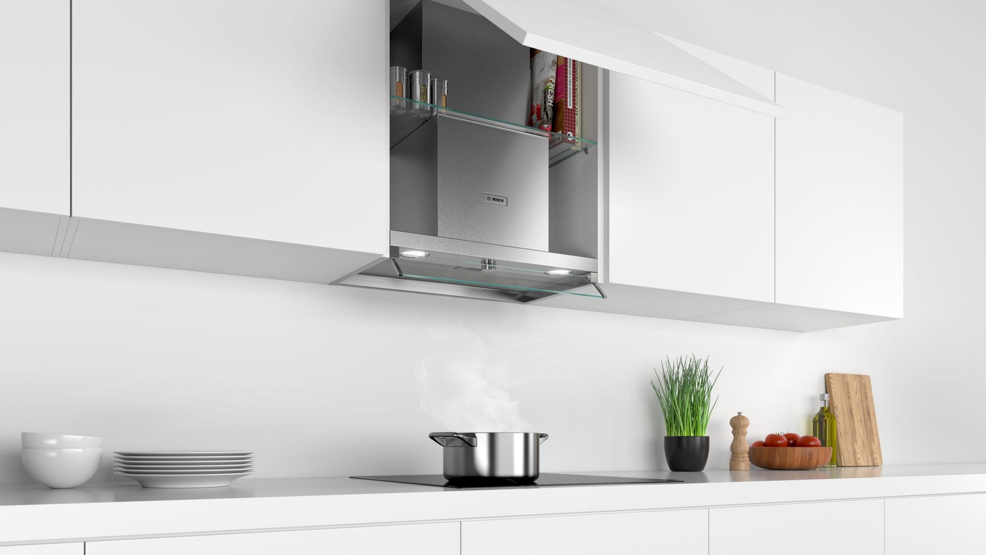 Una moderna cucina con una pentola che emana vapore sul piano cottura.