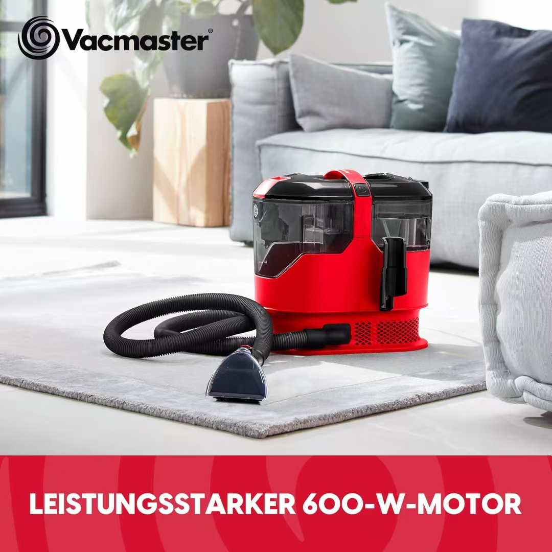 Ein roter Nass-/Trockensauger von Vacmaster mit Schlauch und Düse auf einem Teppich.
