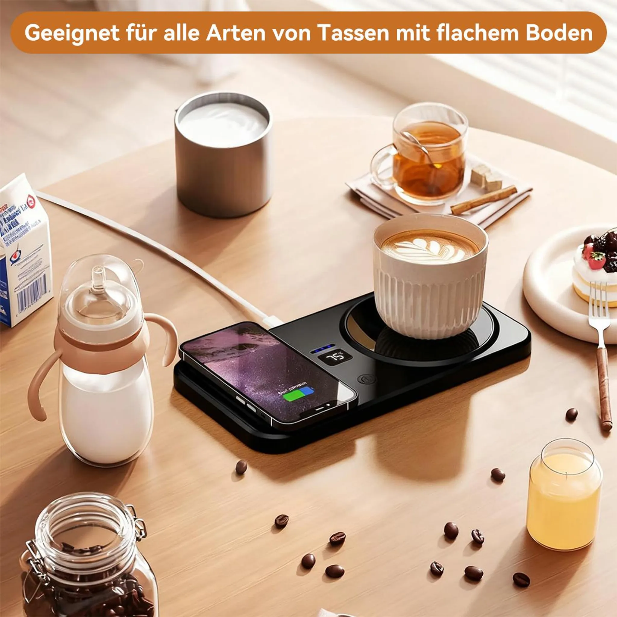 Eine Kaffeetasse, ein Handy und ein Babyfläschchen auf einem Tisch.