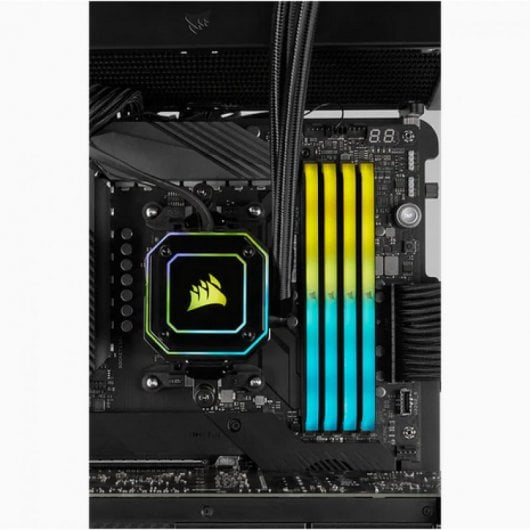 Una placa base de computadora con módulos RAM y disipador de CPU con iluminación RGB.