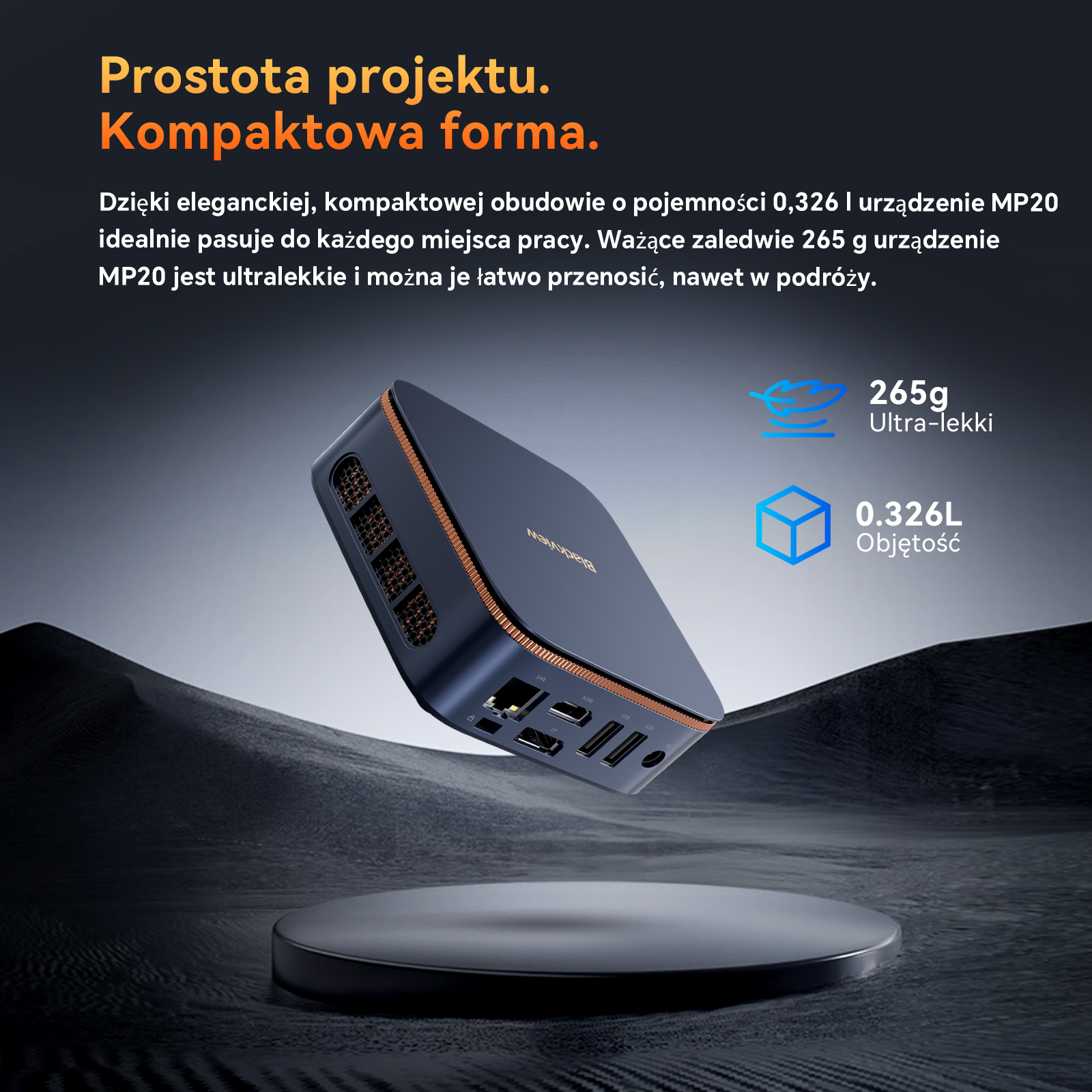 Kompaktowy, granatowy komputer PC z portami i miedzianymi detalami na postumencie.