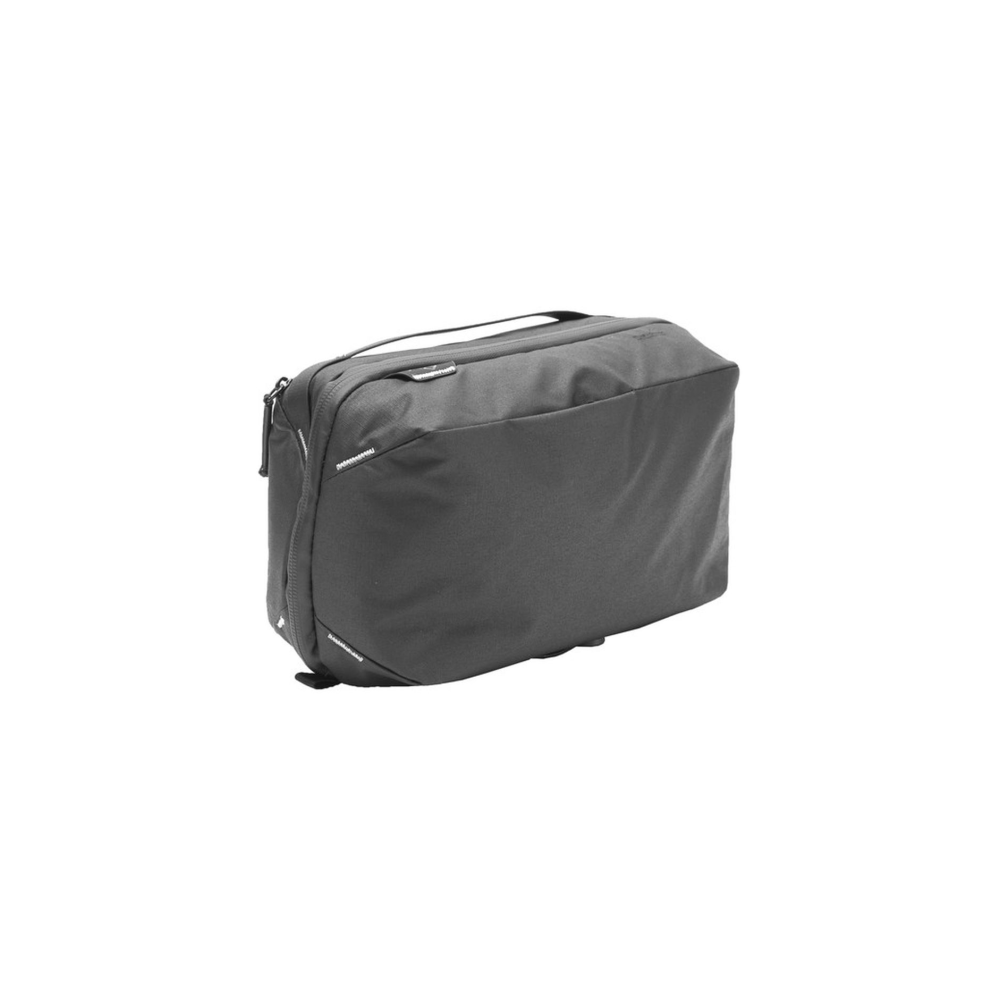 A gray fabric bag with a zipper and handle, displayed on a white background.