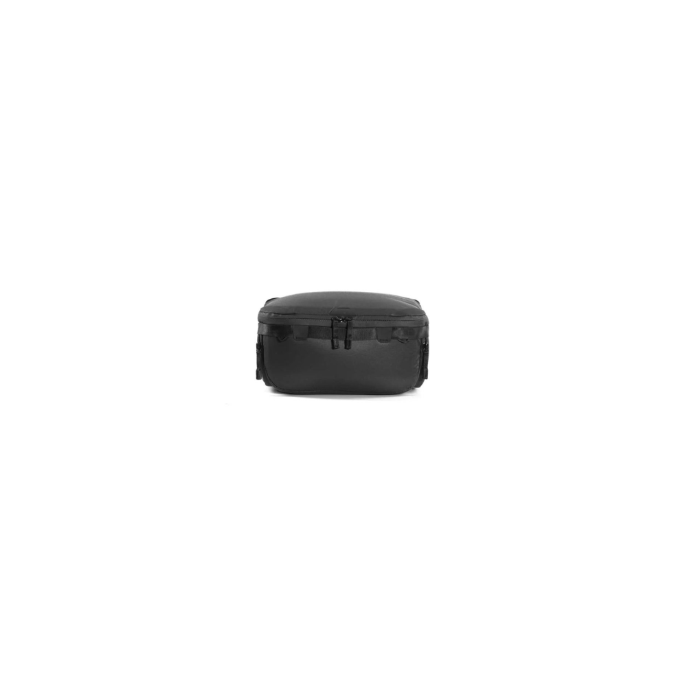 A black bag with zippers sits centered on a white background.