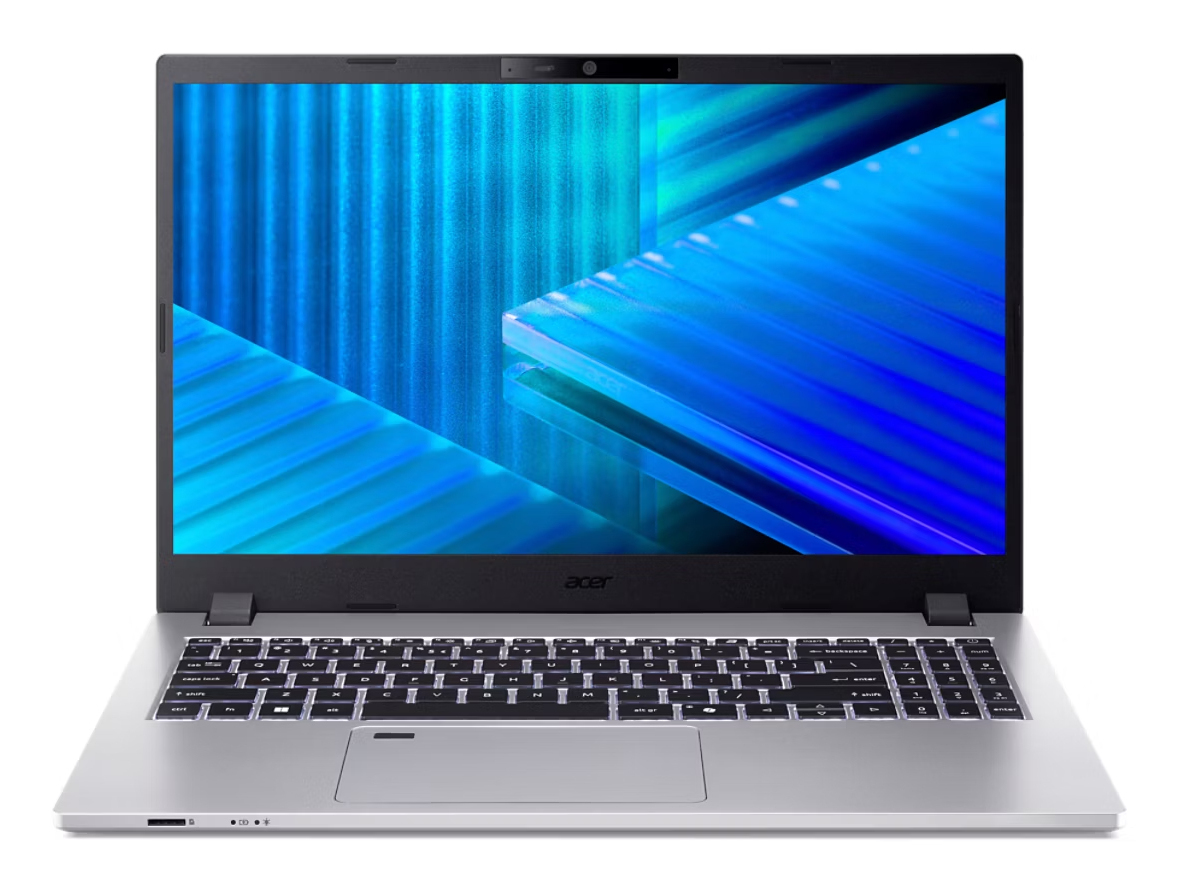 Srebrny laptop z podświetlaną klawiaturą i niebieską tapetą.