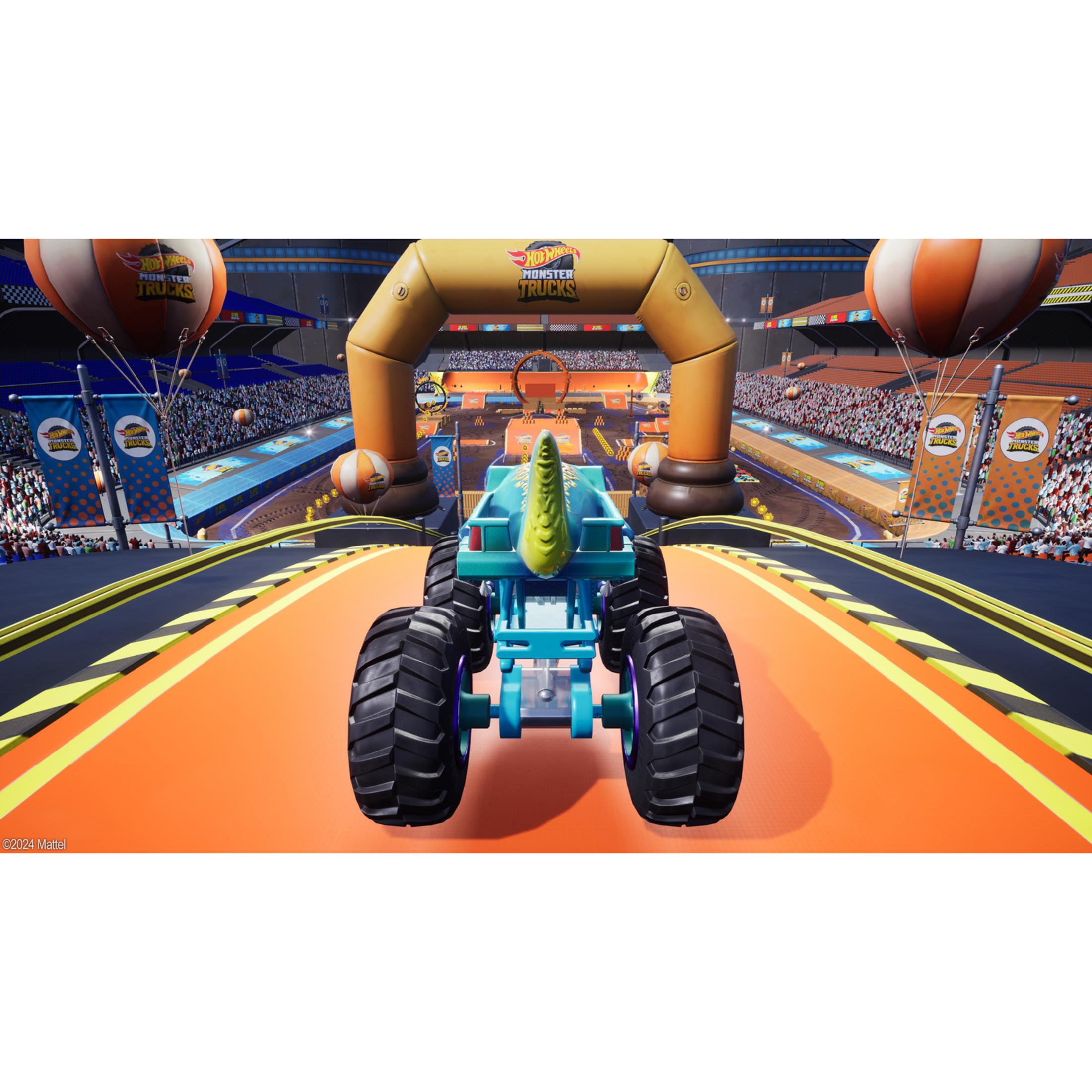 Niebieski monster truck z motywem dinozaura na pomarańczowym torze wyścigowym w stadionie.
