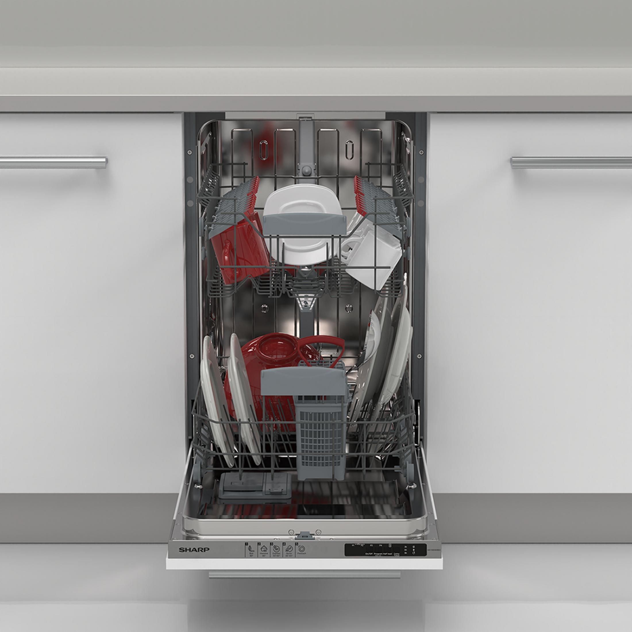 Open dishwasher with red and white dishes, cutlery basket, and silver handles.