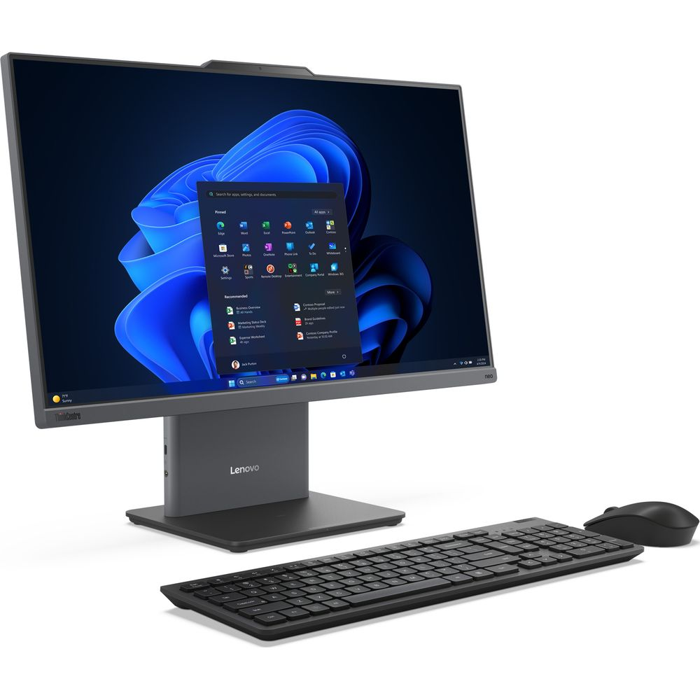 Un ordinateur tout-en-un gris Lenovo avec clavier et souris sur fond bleu.