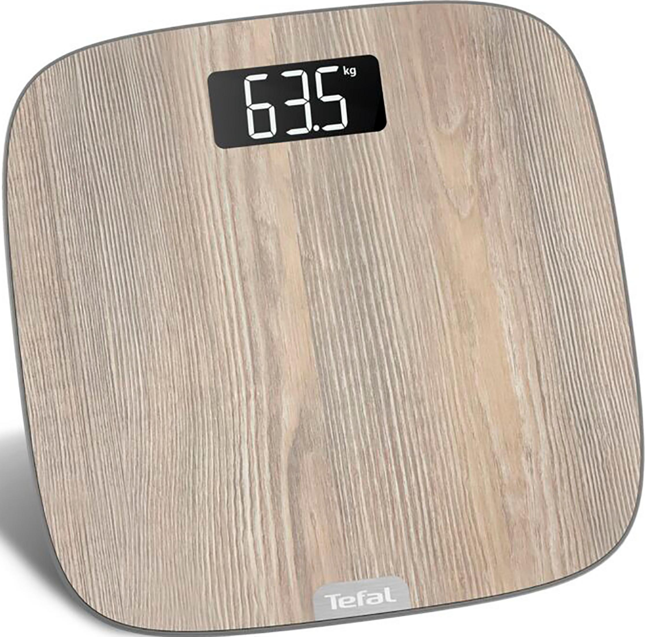 Bilancia da bagno in legno con display digitale che mostra 63,5 kg.