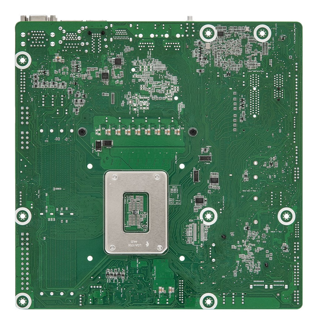 Scheda madre verde con socket CPU argentato e molti piccoli componenti bianchi.
