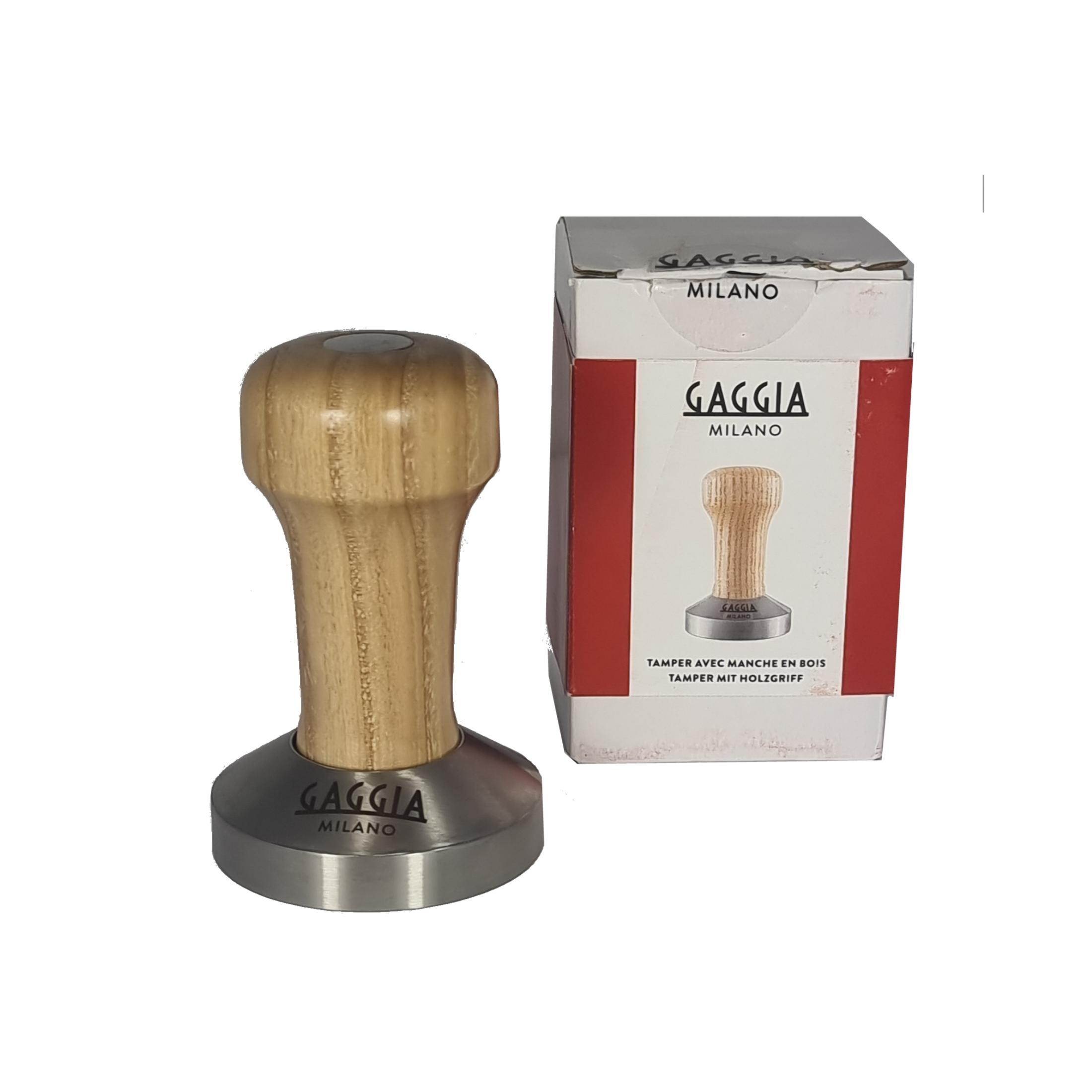 Ein Holzgriff-Tamper von Gaggia Milano neben seiner Verpackung.