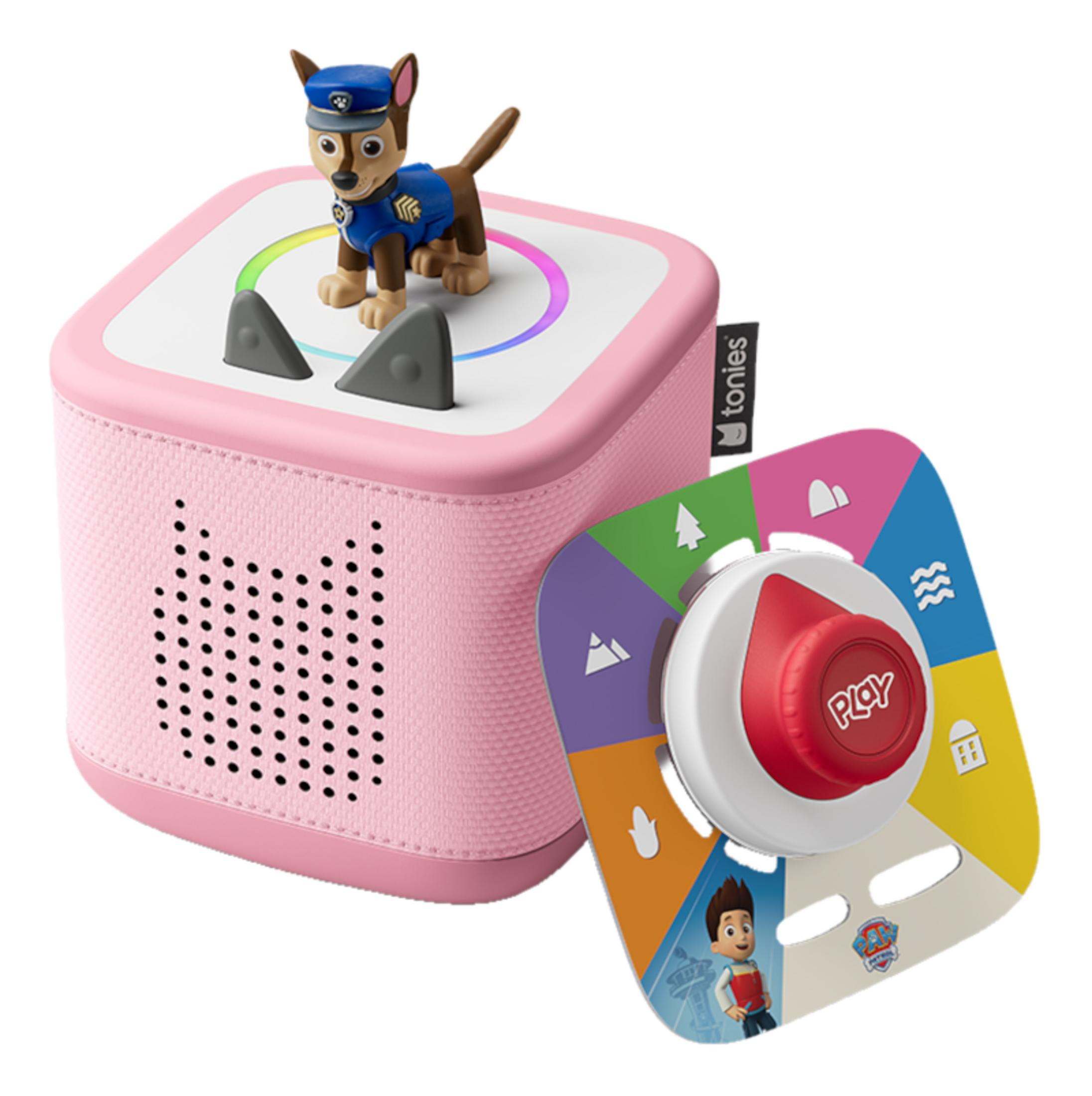 Une enceinte rose avec une figurine Chase de Paw Patrol et un cadran coloré.
