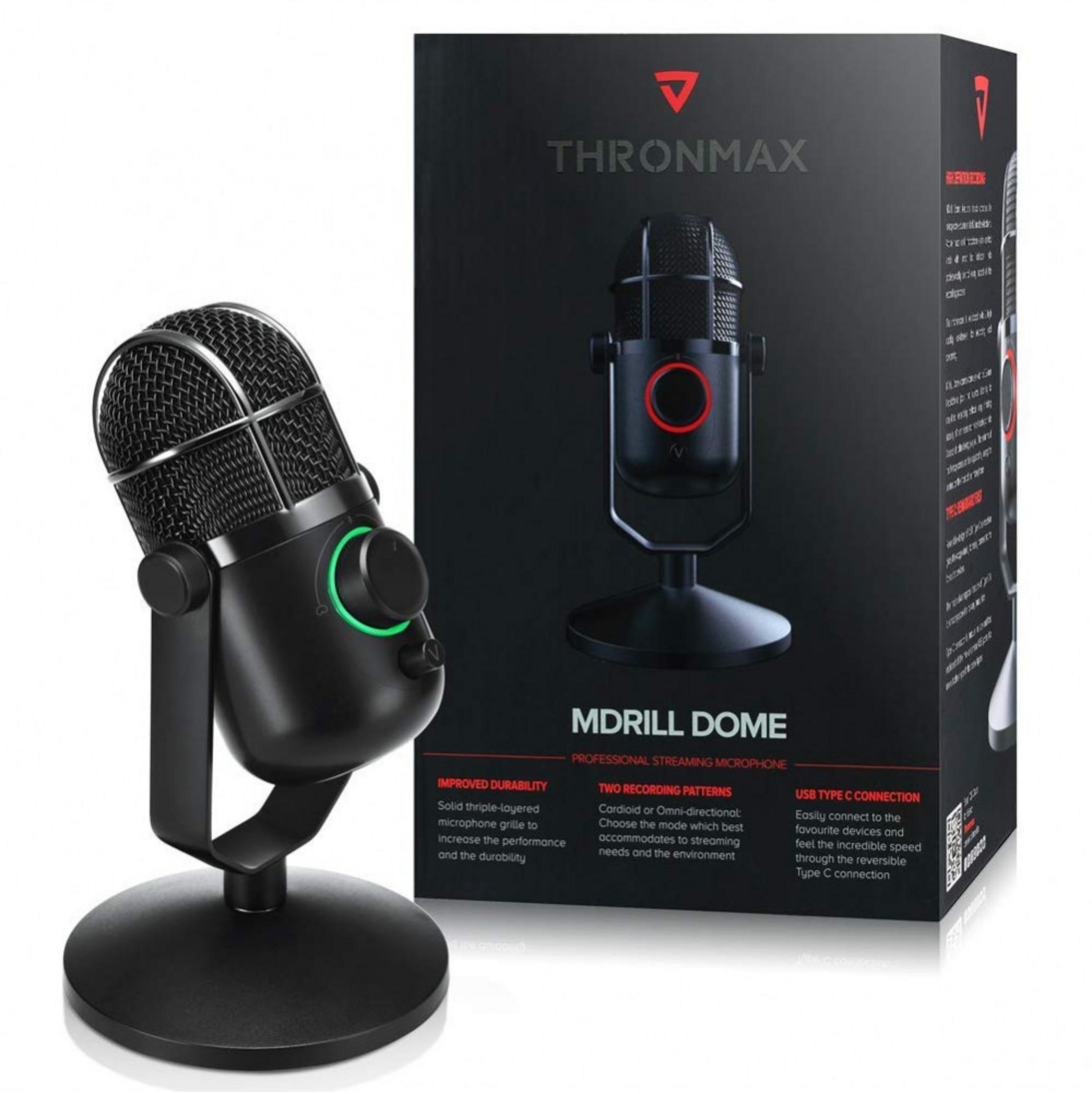 Microfono professionale nero su supporto accanto alla sua scatola. Luce verde sul microfono.