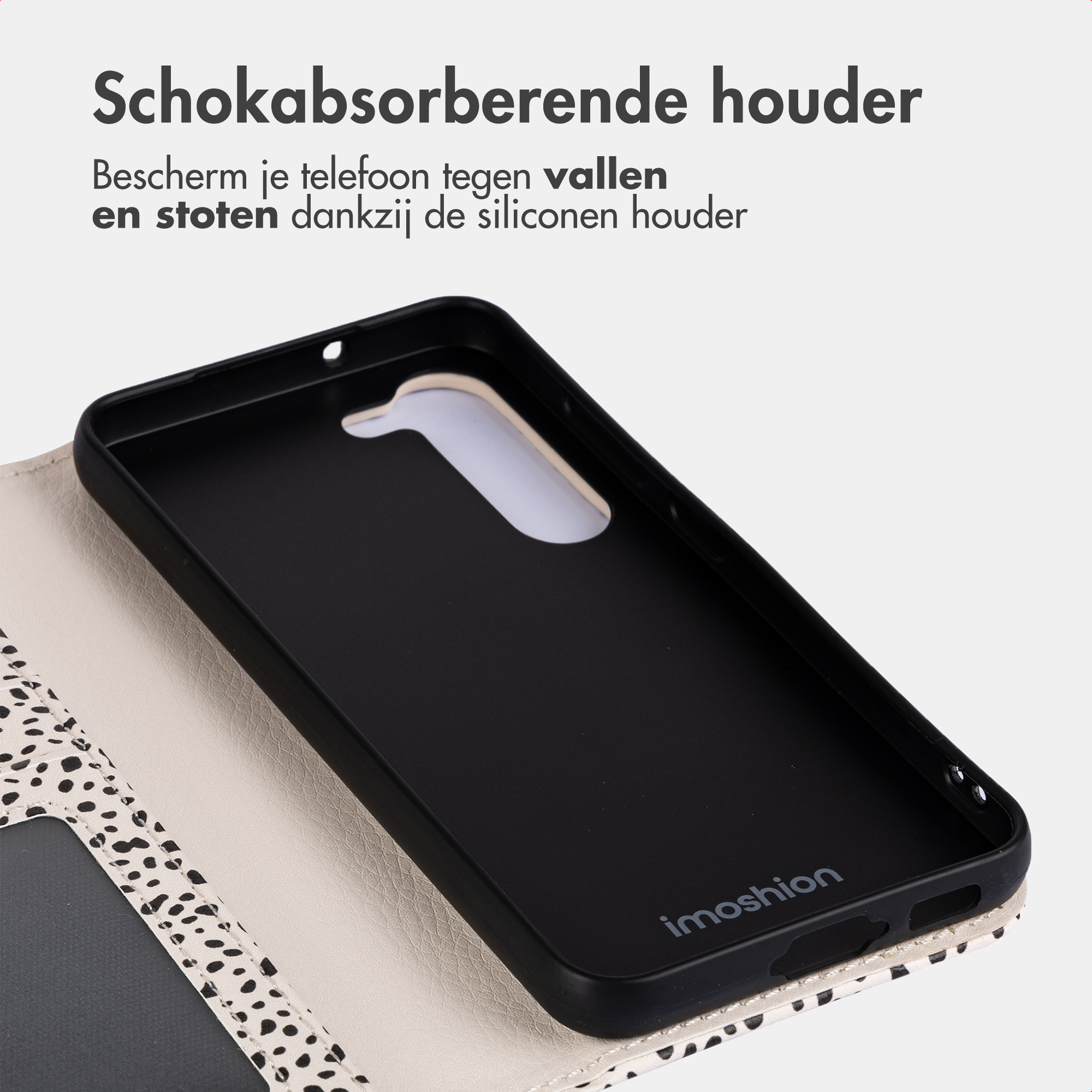 Black phone case with a spotted pattern on the outside and the 'imosion' logo.