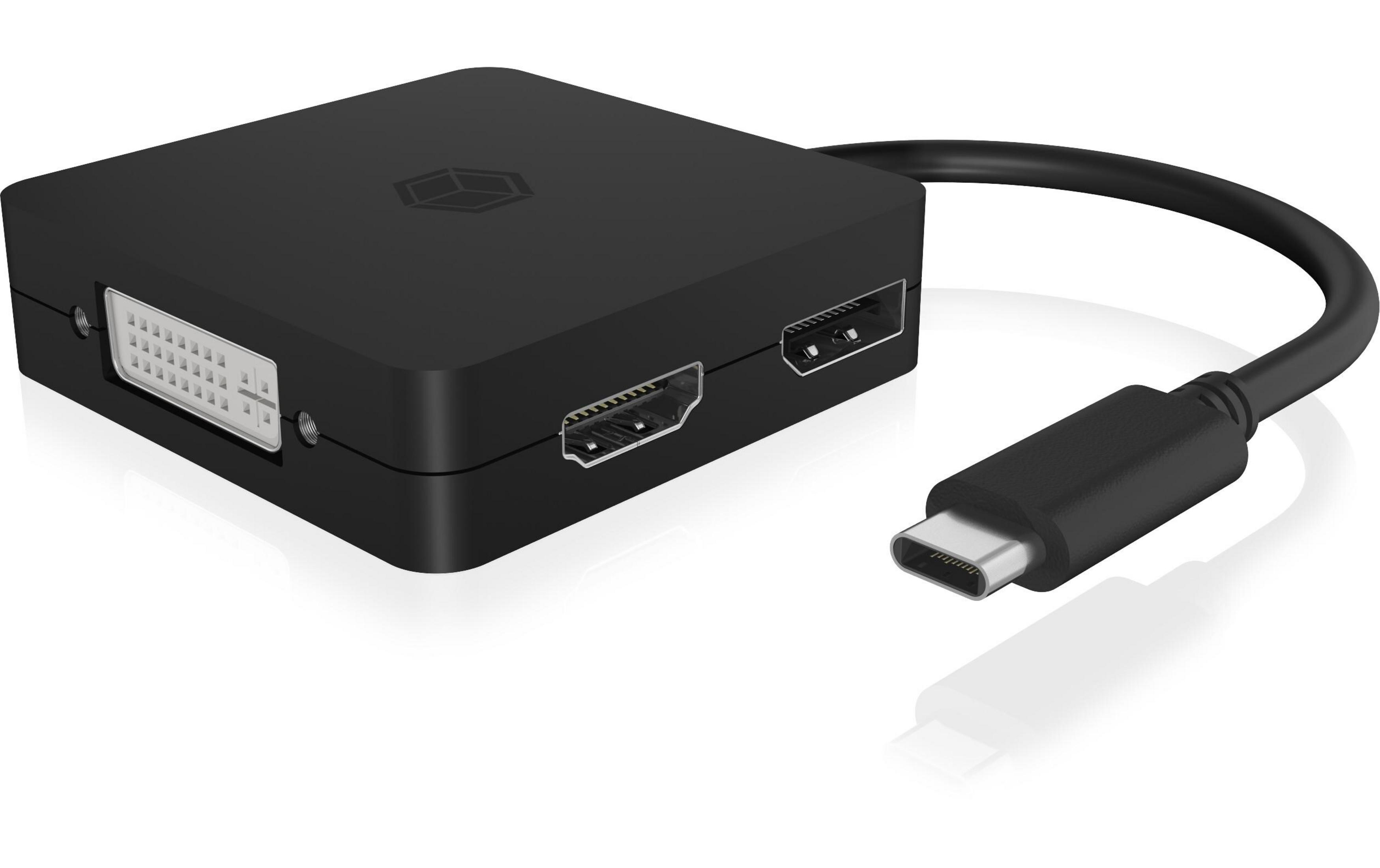 Czarny adapter z portami DVI, HDMI i USB-C, leżący na białym tle.