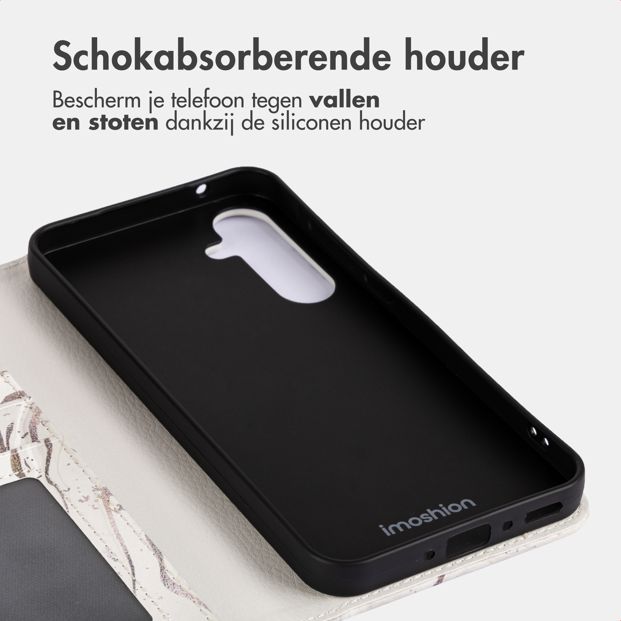Custodia nera per telefono con copertina apribile effetto marmo.