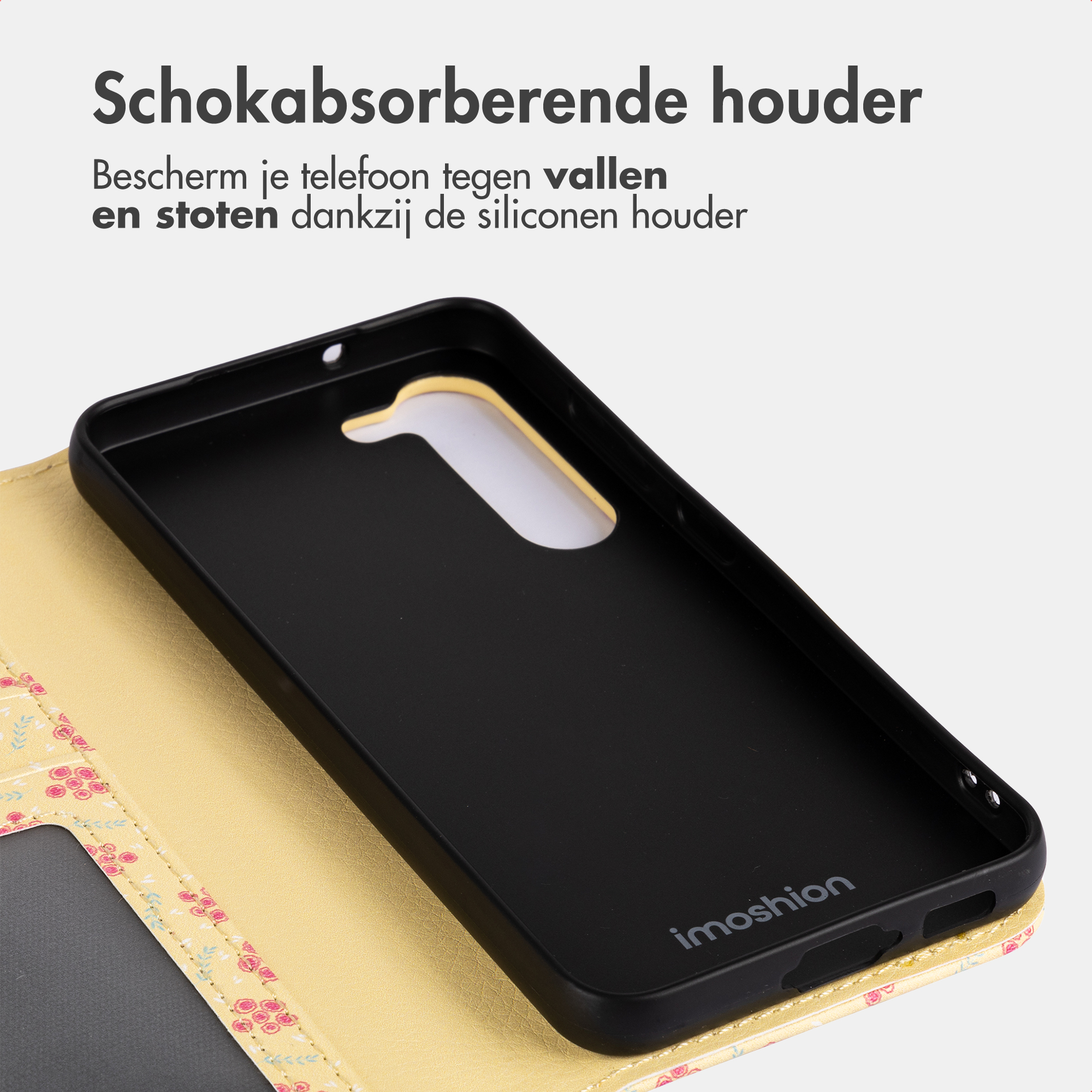 A yellow floral phone case with a black phone holder inside.
