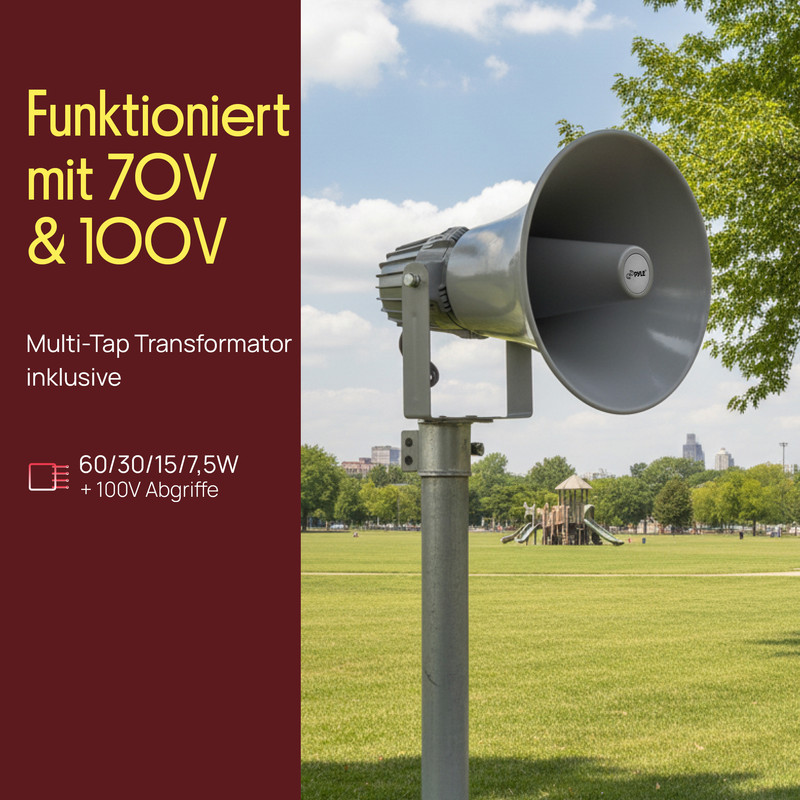 Grauer Hornlautsprecher auf Pfahl, mit Text auf Deutsch, im Hintergrund Park mit Spielplatz.