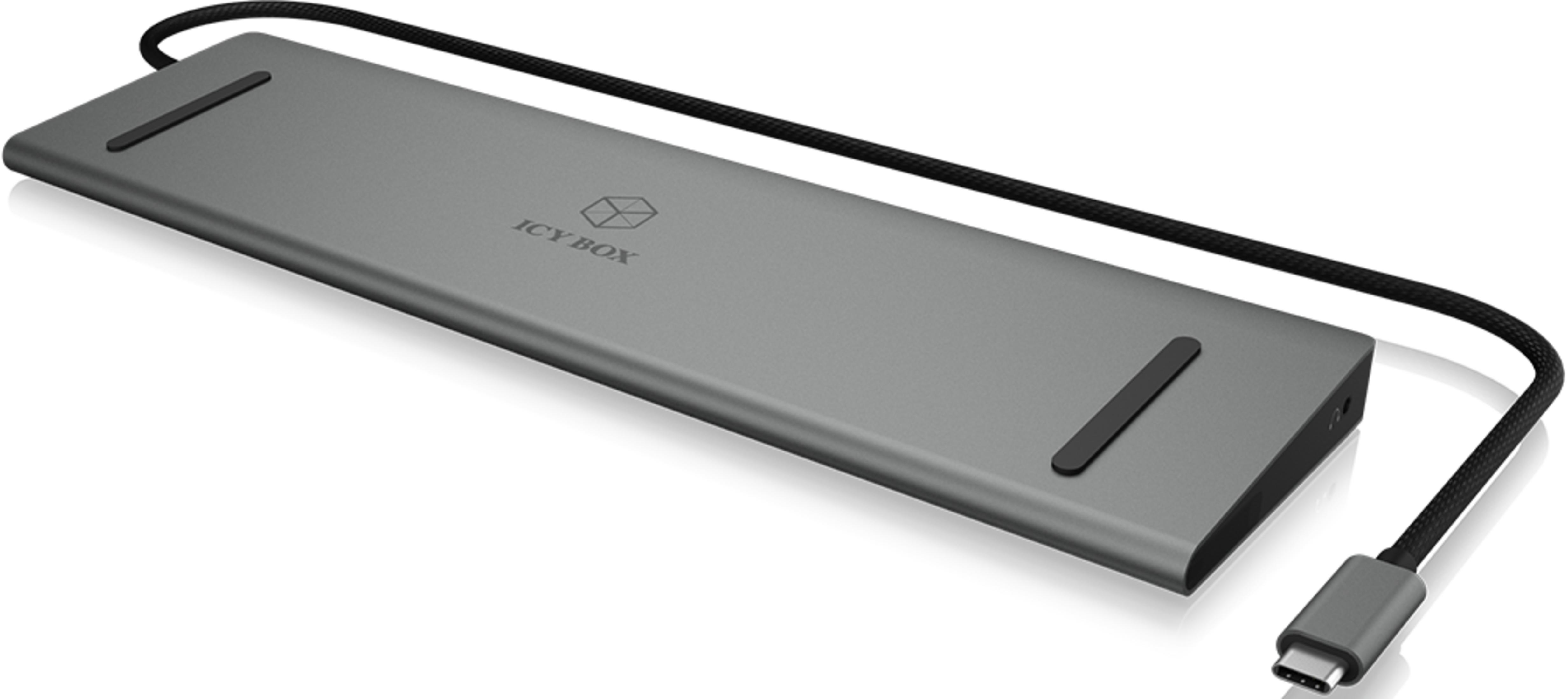 Grauer USB-C-Hub mit schwarzem Kabel und Stecker auf weißem Hintergrund.