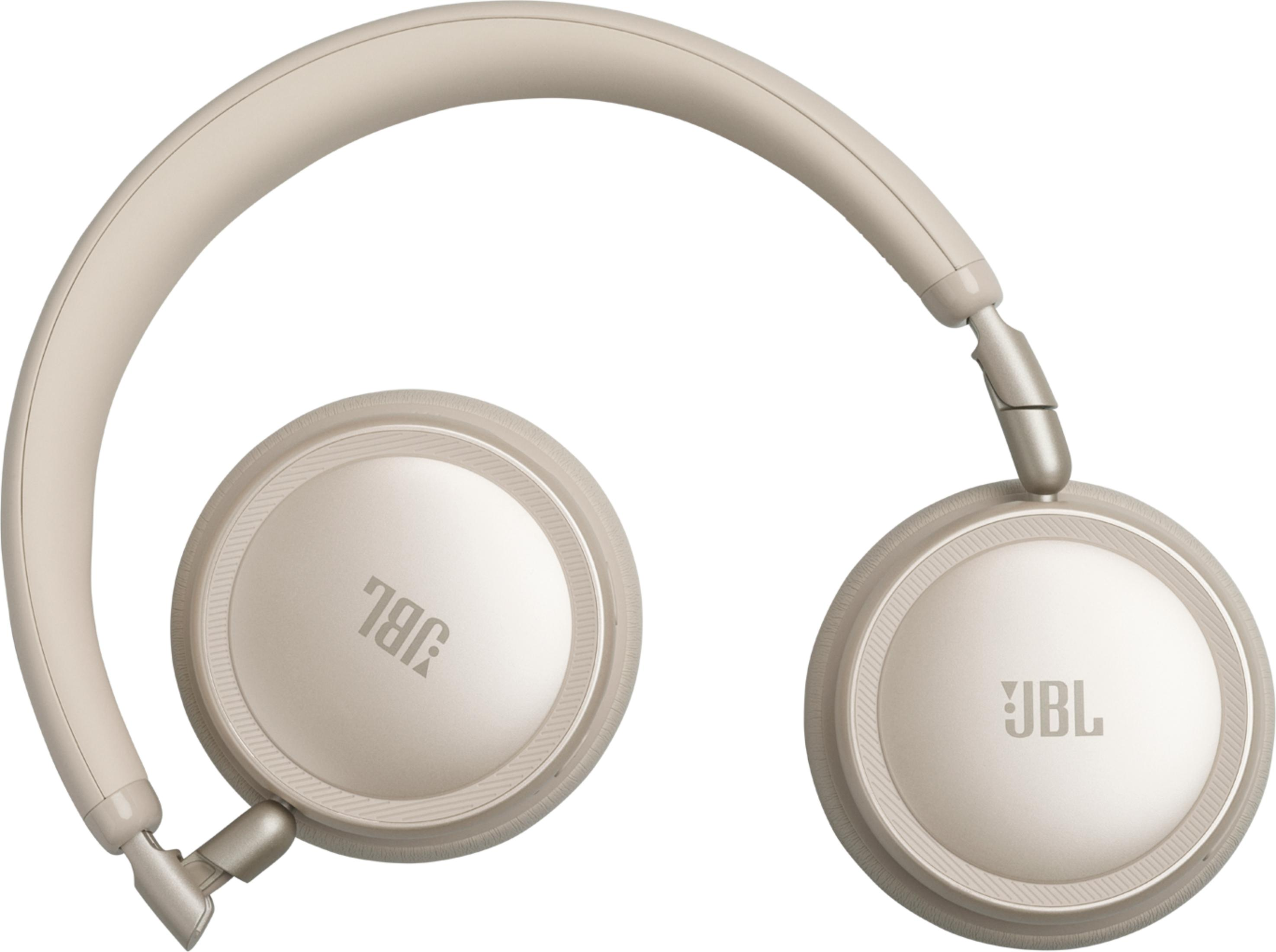 Cuffie JBL beige con archetto imbottito e padiglioni rotondi.