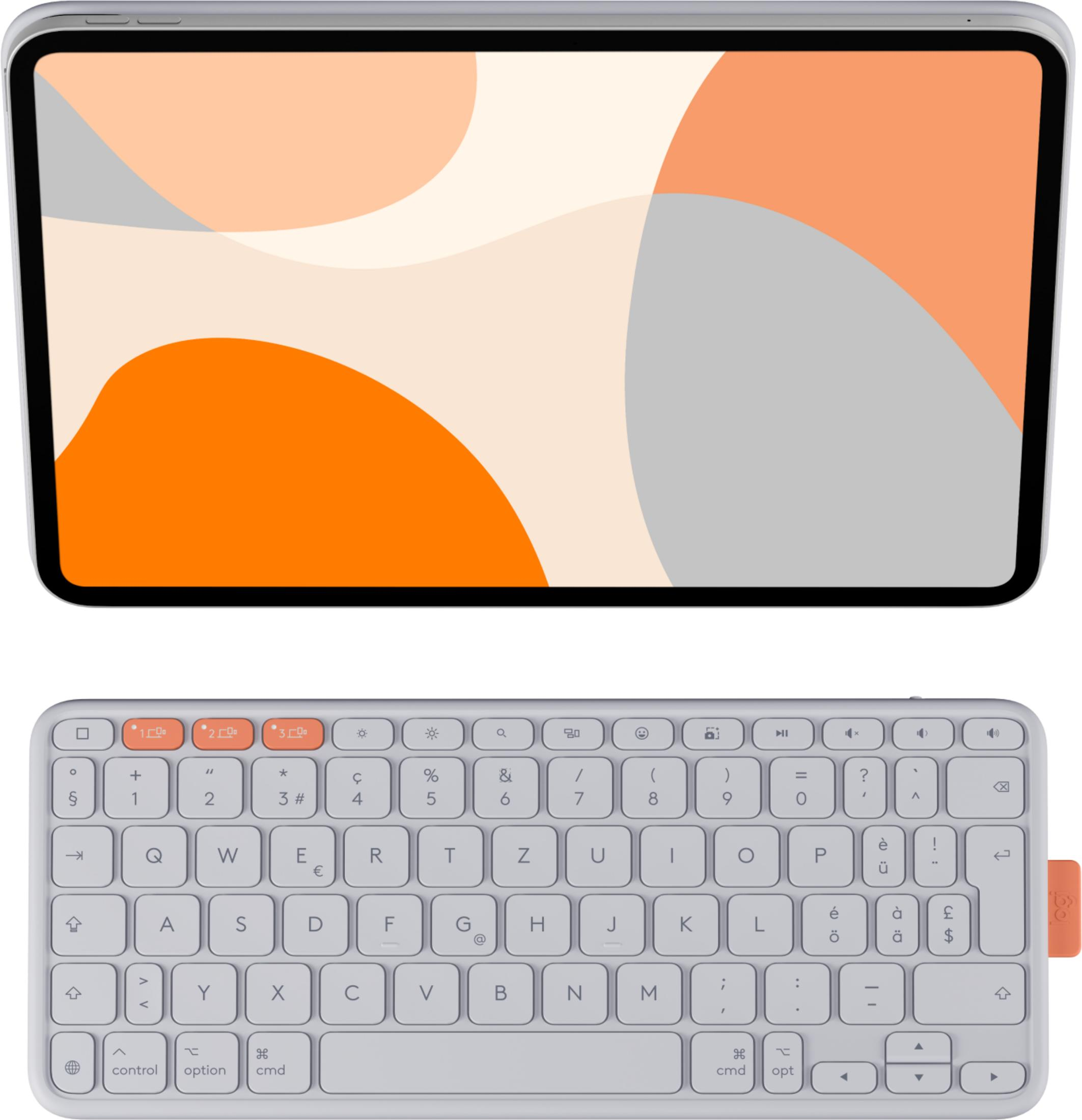 Une tablette avec un fond coloré repose au-dessus d'un clavier d'ordinateur.