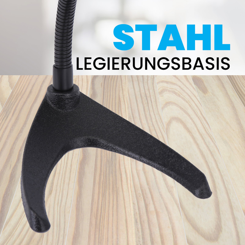 Ein schwarzer Metallfuß mit flexibler Stange auf einem Holztisch.