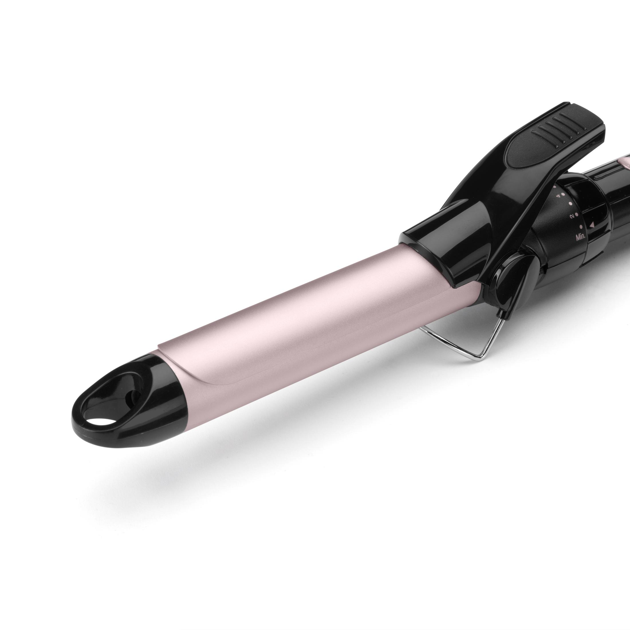 Un ferro arricciacapelli color oro rosa con manico nero e quadrante.