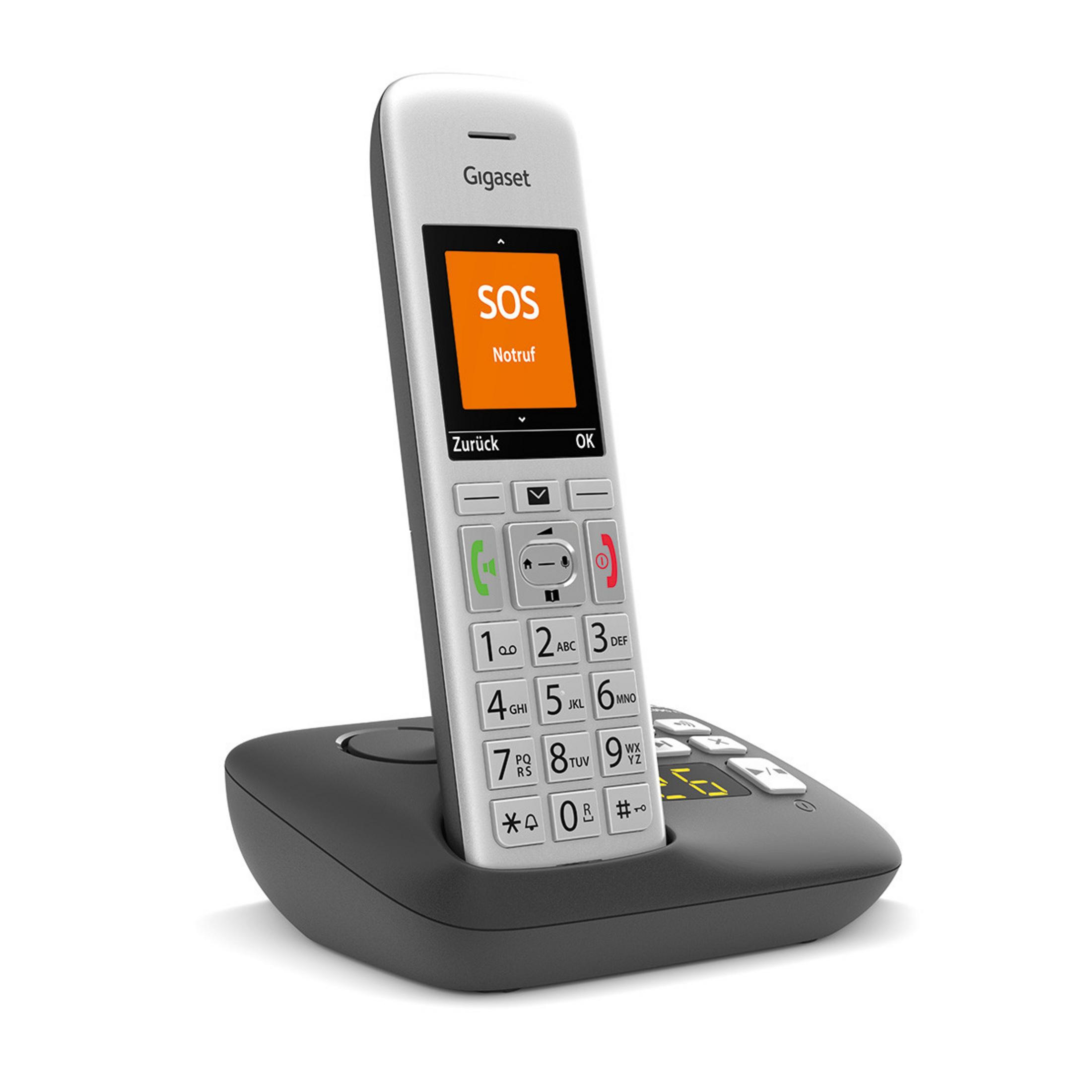 Un telefono Gigaset argentato con funzione SOS sulla base.