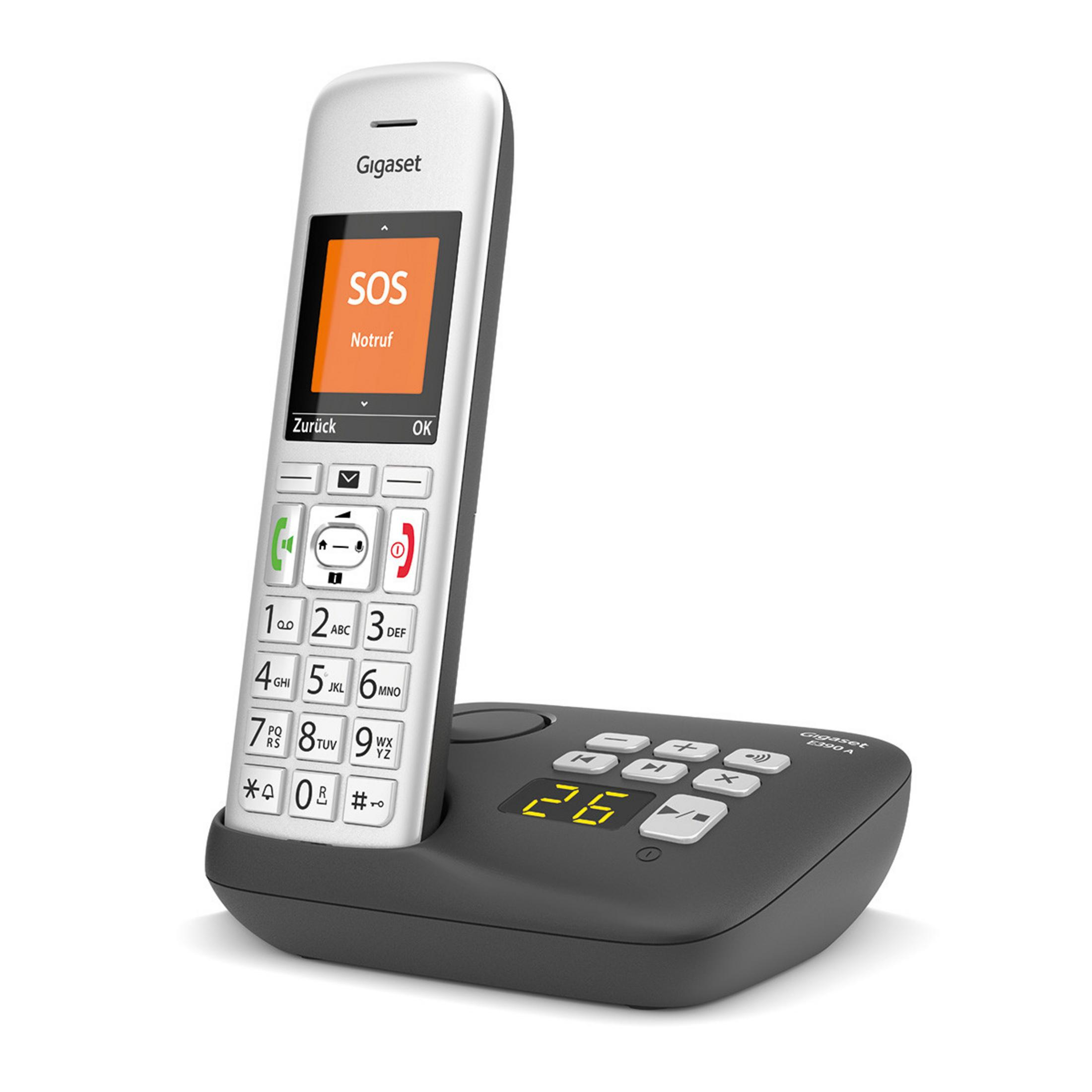 Un telefono Gigaset bianco con display SOS su una base con cifre gialle.