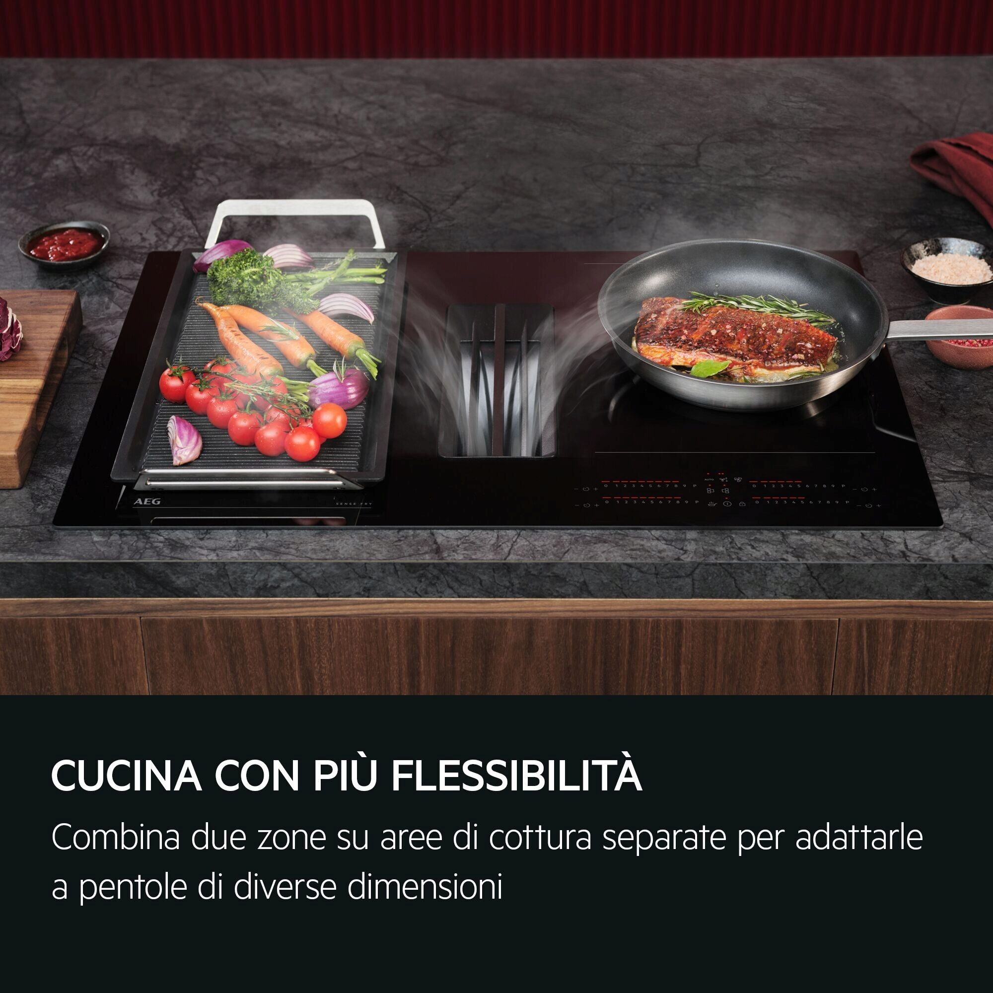 Un moderno piano cottura a induzione con griglia e padella. Verdure e carne in cottura.