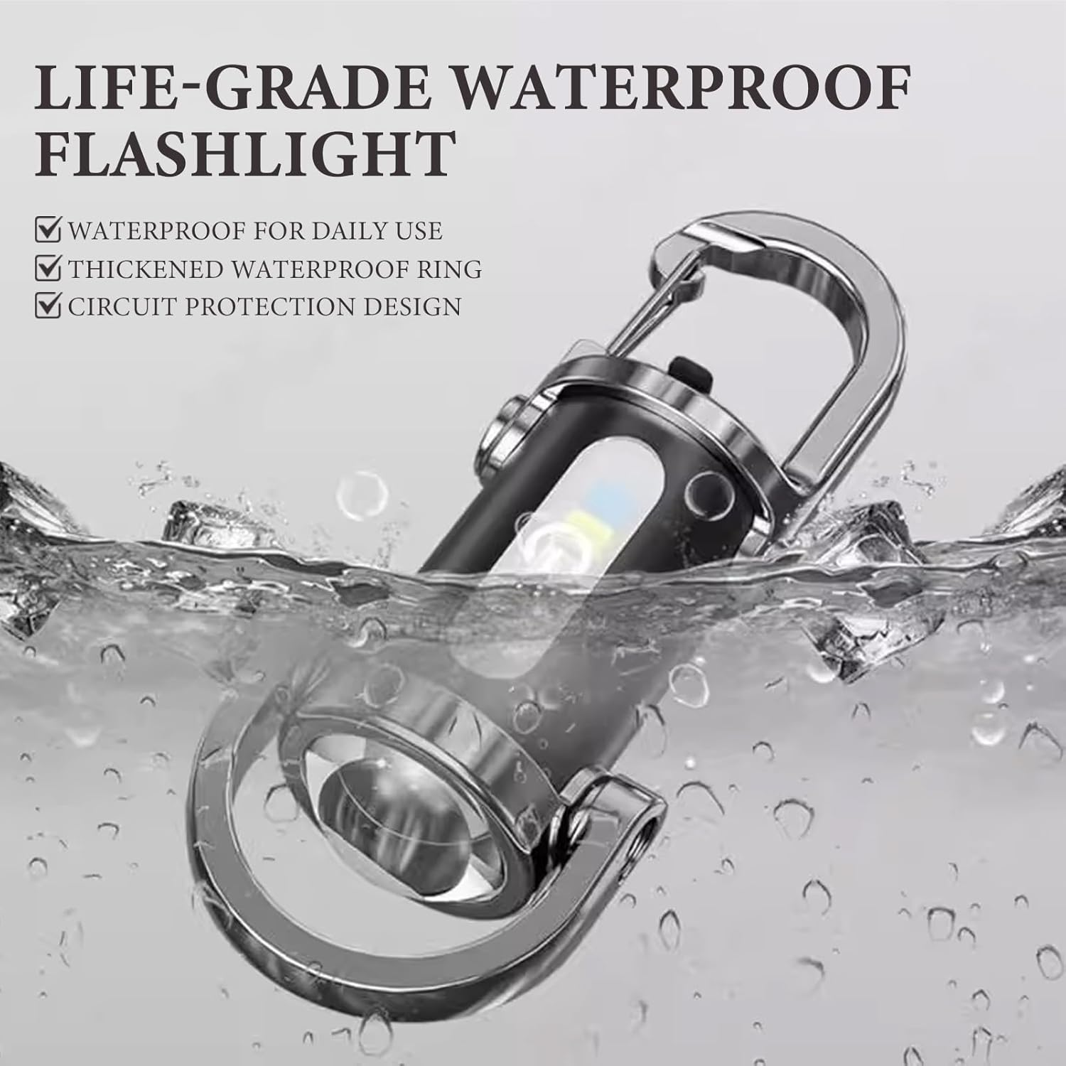Wasserdichte Taschenlampe mit Karabinerhaken taucht in Wasser.