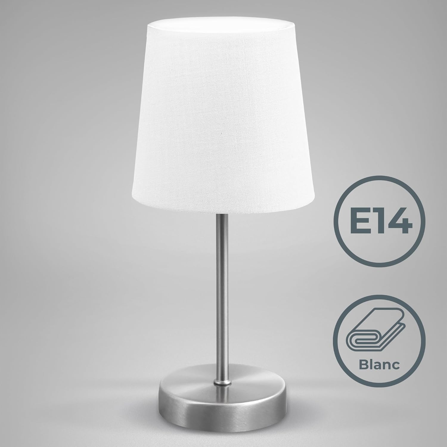 Eine weiße Lampe mit silbernem Ständer und kreisförmigen Symbolen E14 und Blanc.