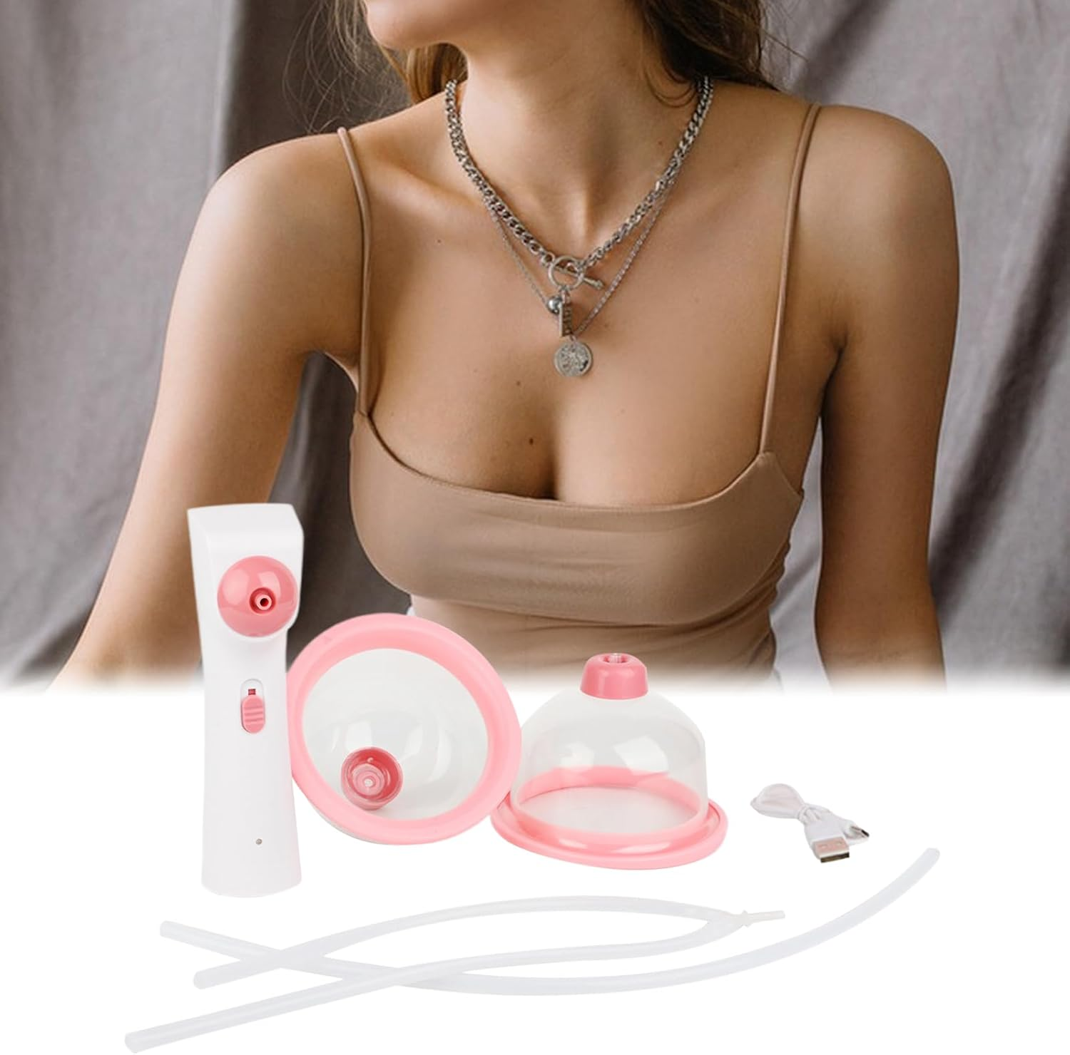 Ein weißes und pinkes Milchpumpen-Set mit Schläuchen und USB-Kabel auf weißer Fläche.