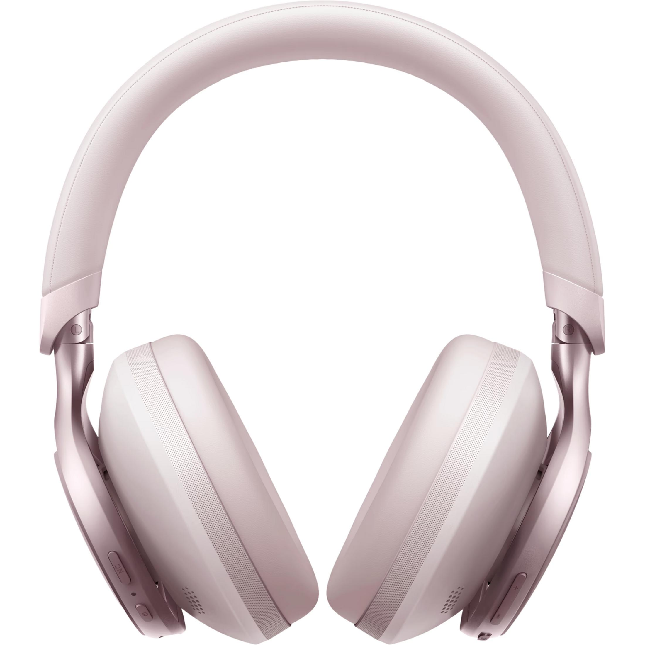Un par de auriculares rosas de diadema con detalles plateados, sobre fondo blanco.