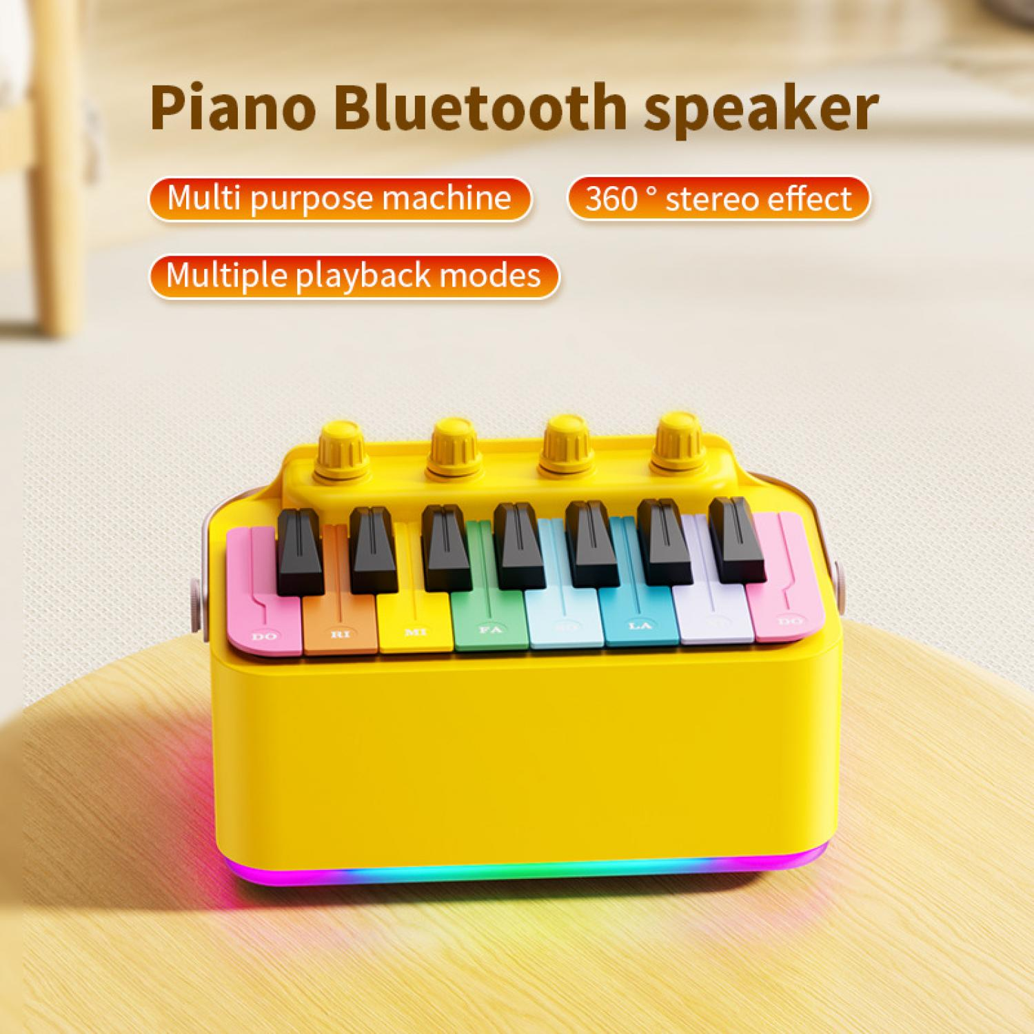 Gelber Bluetooth-Lautsprecher in Klavierform mit bunten Tasten und Lichtern.