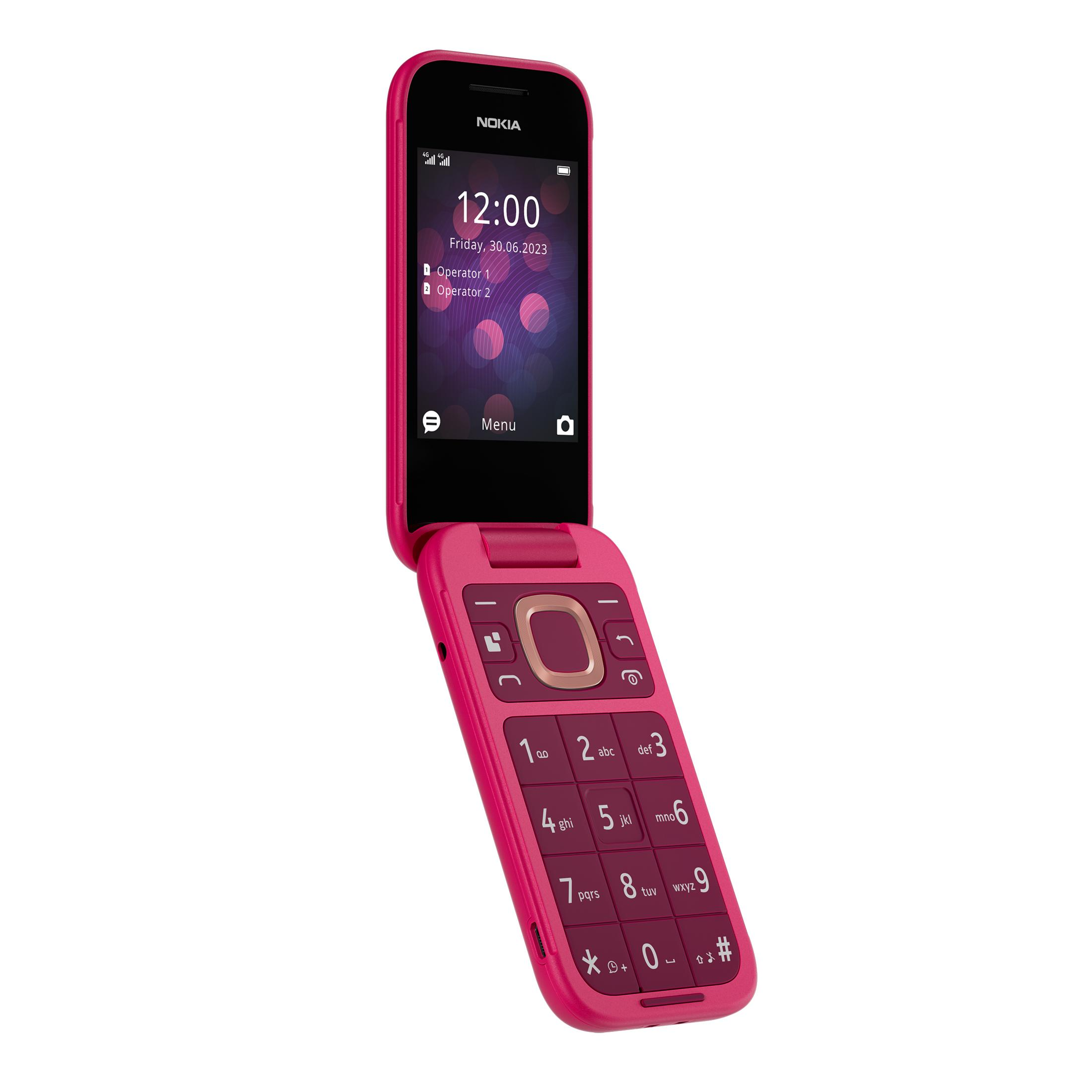 Un teléfono plegable Nokia rosa está abierto, mostrando el teclado y la pantalla con la hora.
