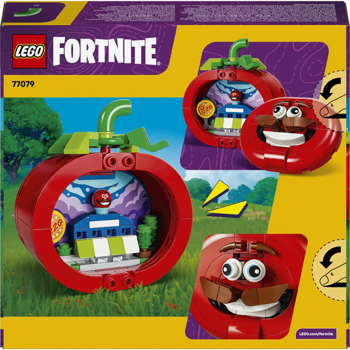 Set di pomodori Lego Fortnite su erba verde con alberi sullo sfondo.