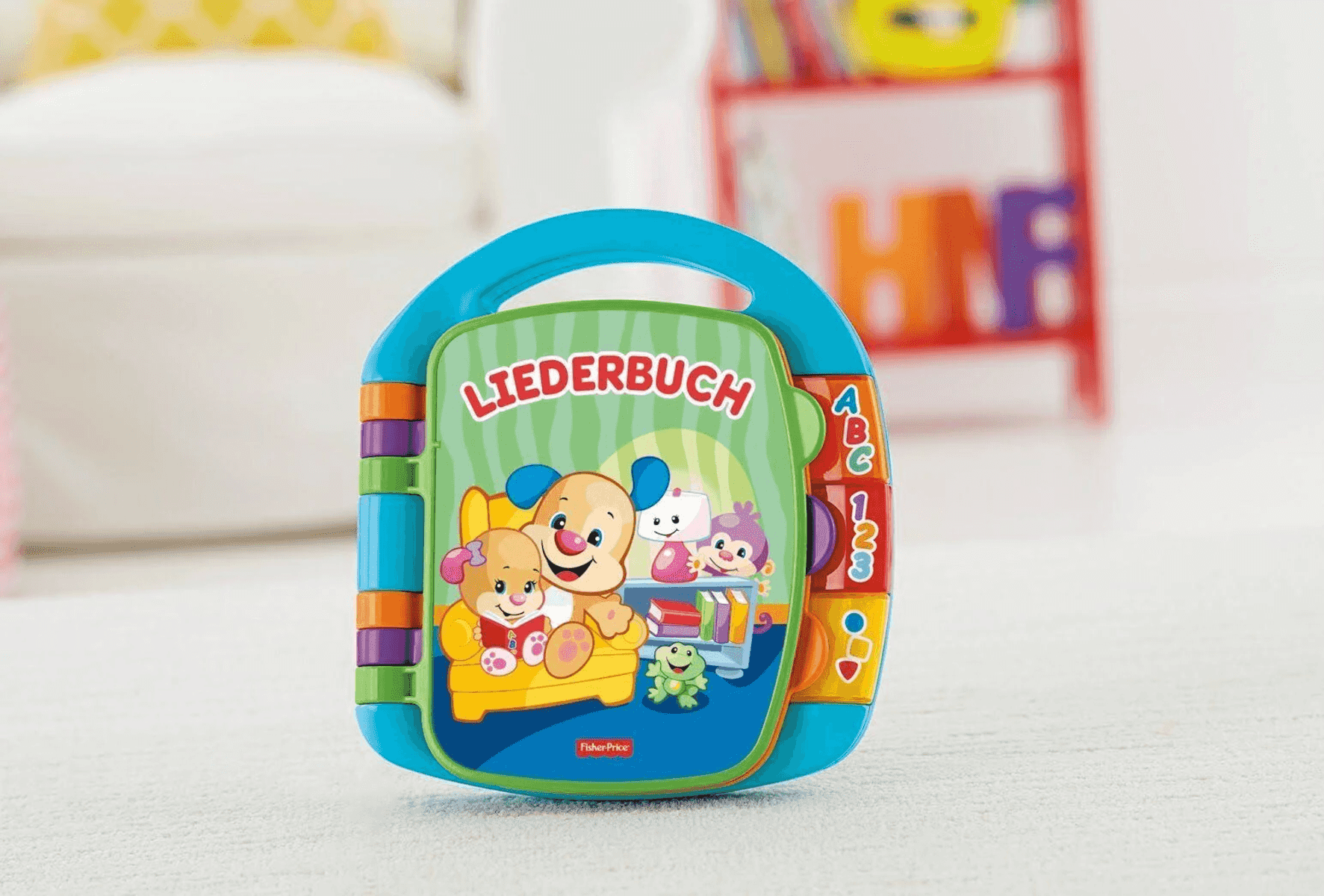 Ein buntes Fisher-Price-Liederbuch mit Hunden, Affen und einem Frosch.