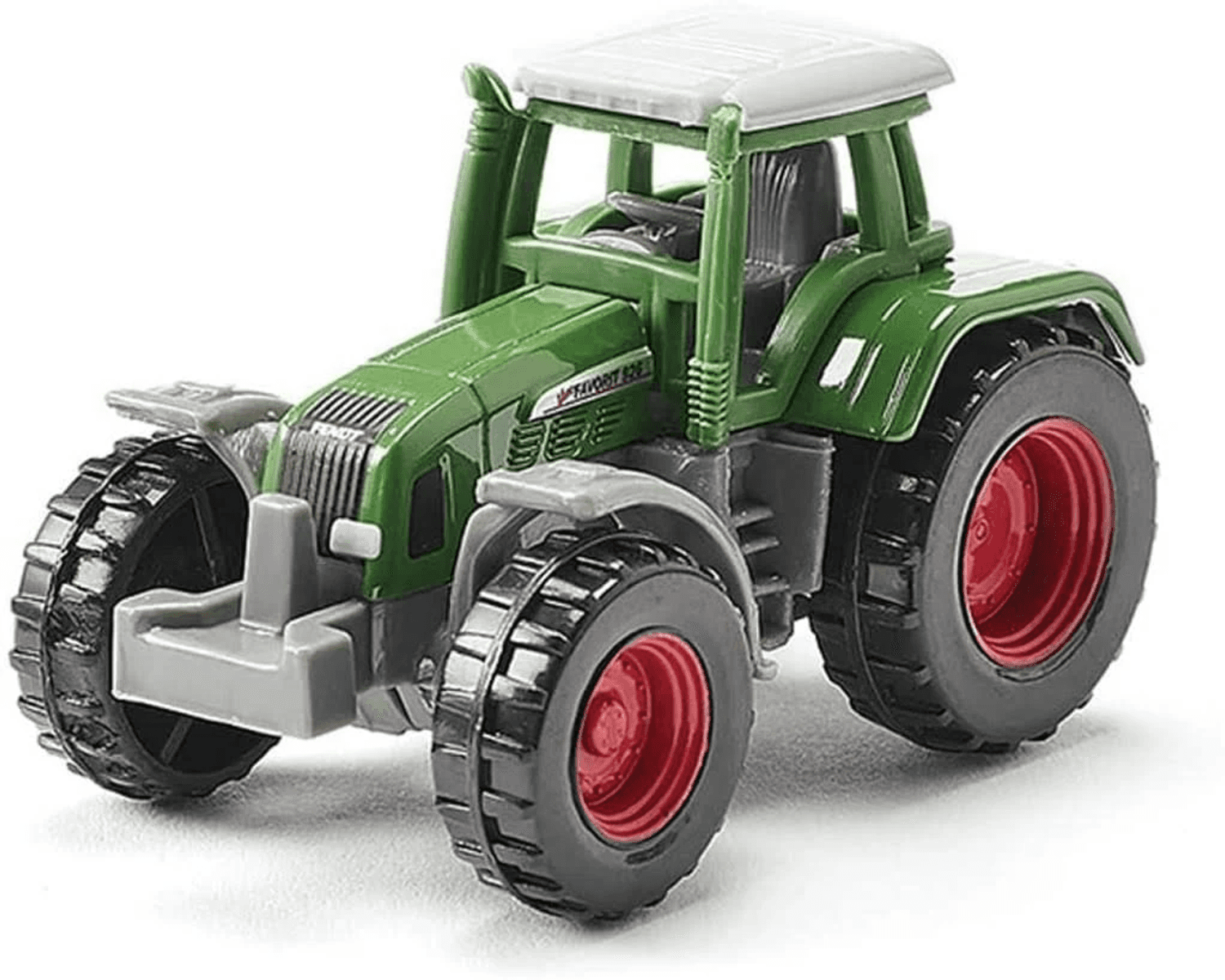 Ein grüner Spielzeugtraktor mit roten Felgen und großen Reifen.