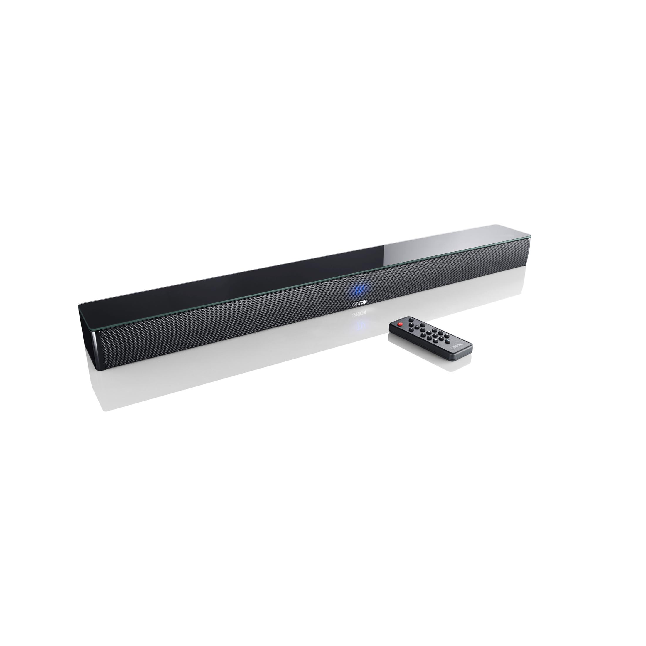 A black soundbar with a remote control on a white background.